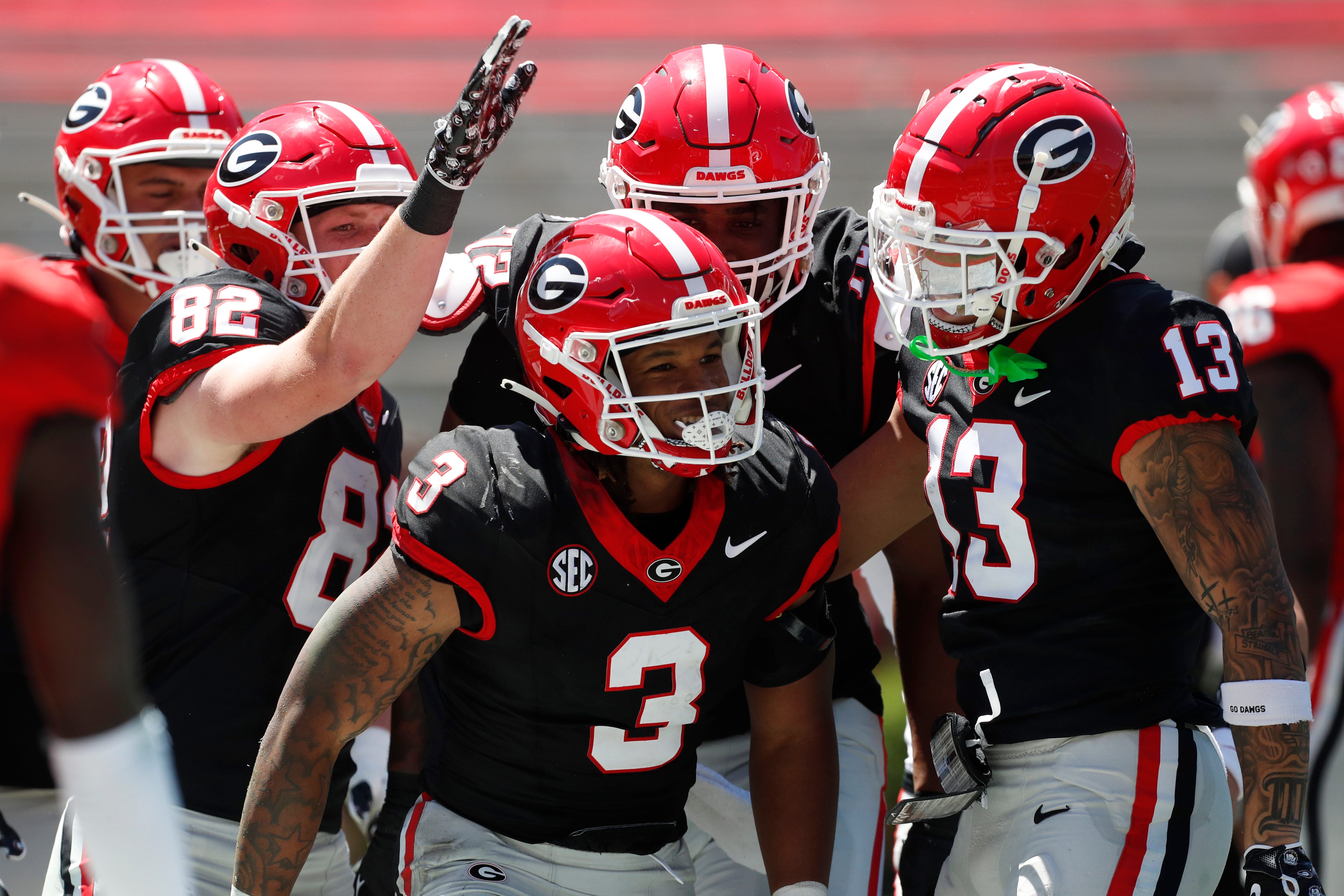 Georgia running back Andrew Paul (3) celebrates with his teammates after scoring a touchdown during the G-Day spring football game in Athens, Ga., on Saturday, April 13, 2024.