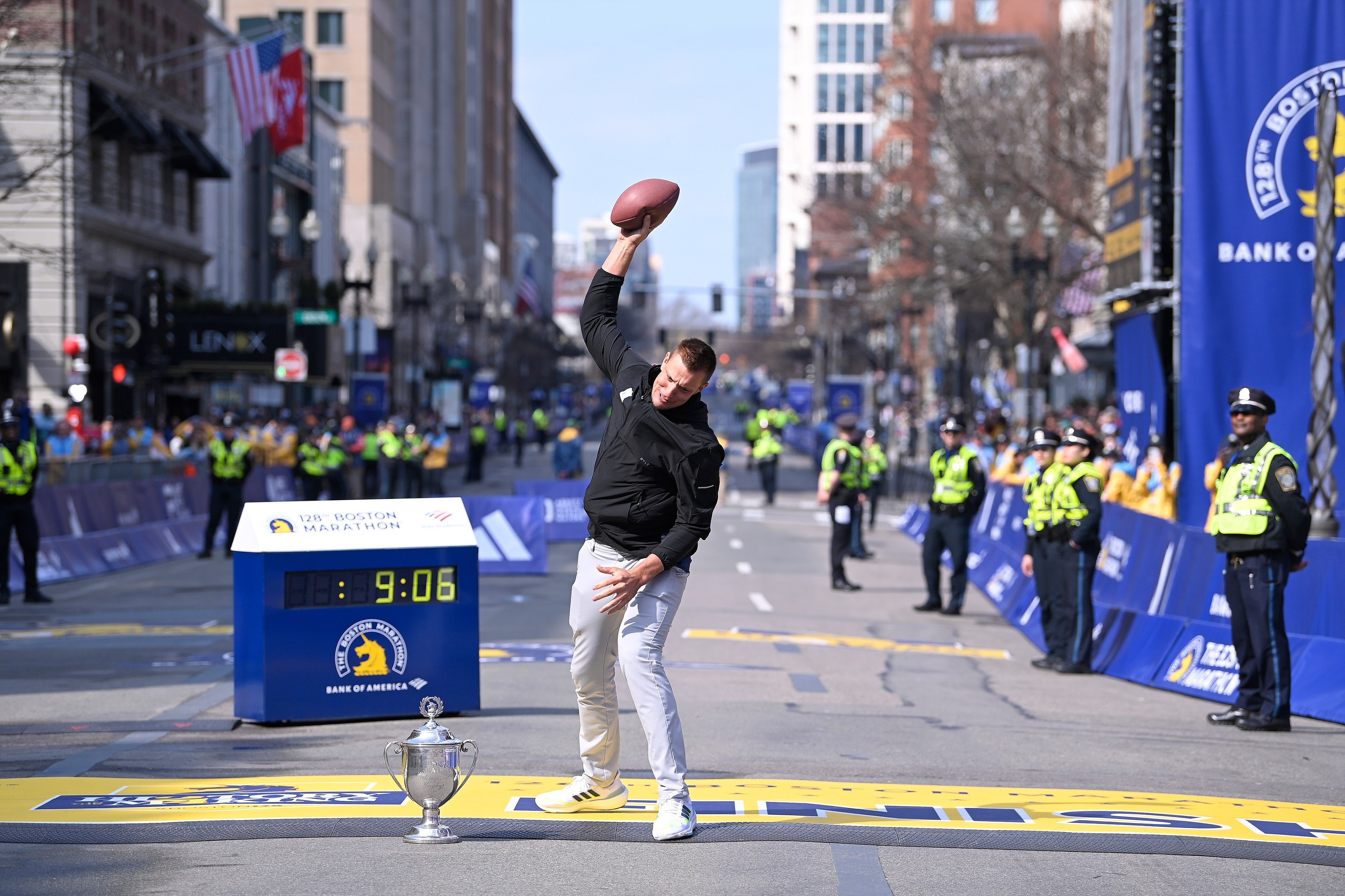 Apr 15, 2024; Boston, MA, USA; Former New England Patriots tight end and honorary Grand Marshall Rob Gronkowski spikes a football on the finish line of the 2024 Boston Marathon