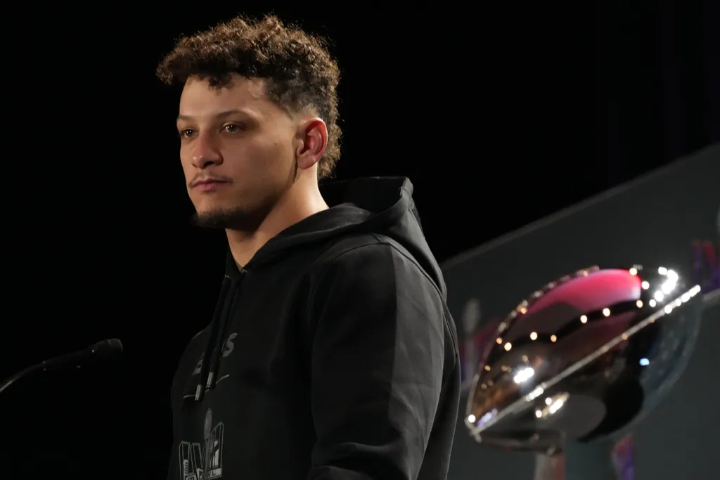 Kansas City Chiefs quarterback Patrick Mahomes speaks at the Super Bowl LVIII Winning Head Coach and Most Valuable Player Press Conference flanked by the Vince Lombardi trophy at the Super Bowl 58 med...