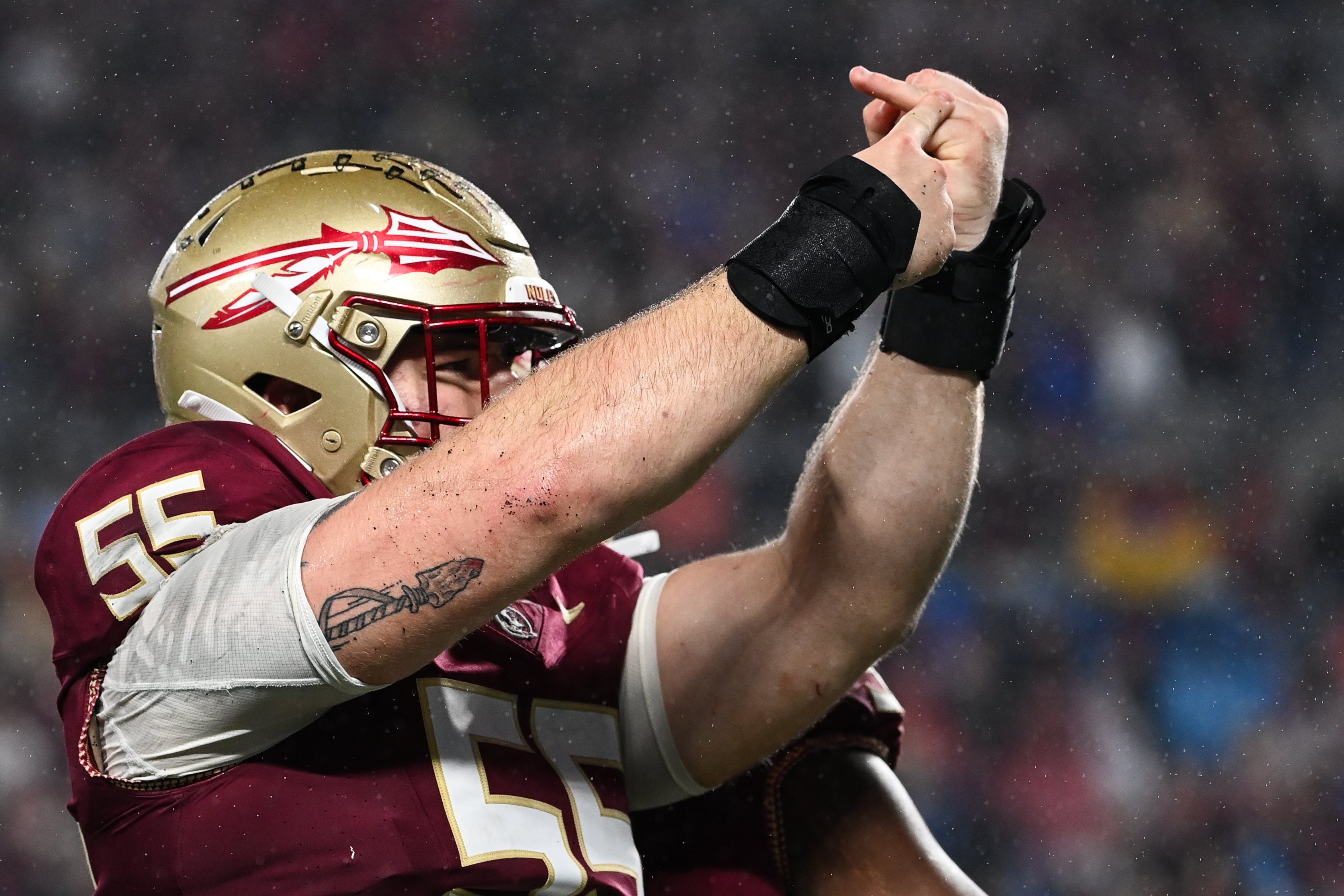 Dec 2, 2023; Charlotte, NC, USA; Florida State Seminoles defensive lineman Braden Fiske (55) gestures to his ring finger after sacking Louisville Cardinals quarterback Jack Plummer (not pictured) in the fourth quarter at Bank of America Stadium. Mandatory Credit: Bob Donnan-USA TODAY Sports