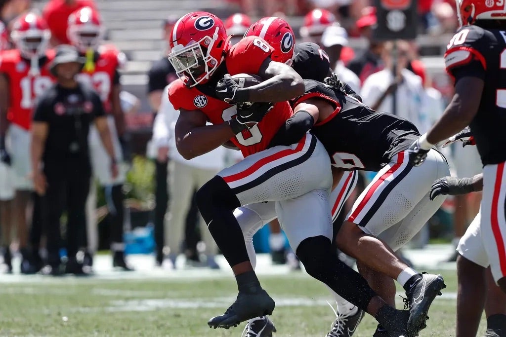 Georgia wide receiver Colbie Young (8) fights for extra yardage during the G-Day spring football game in Athens, Ga., on Saturday, April 13, 2024. The game ended in a tie.