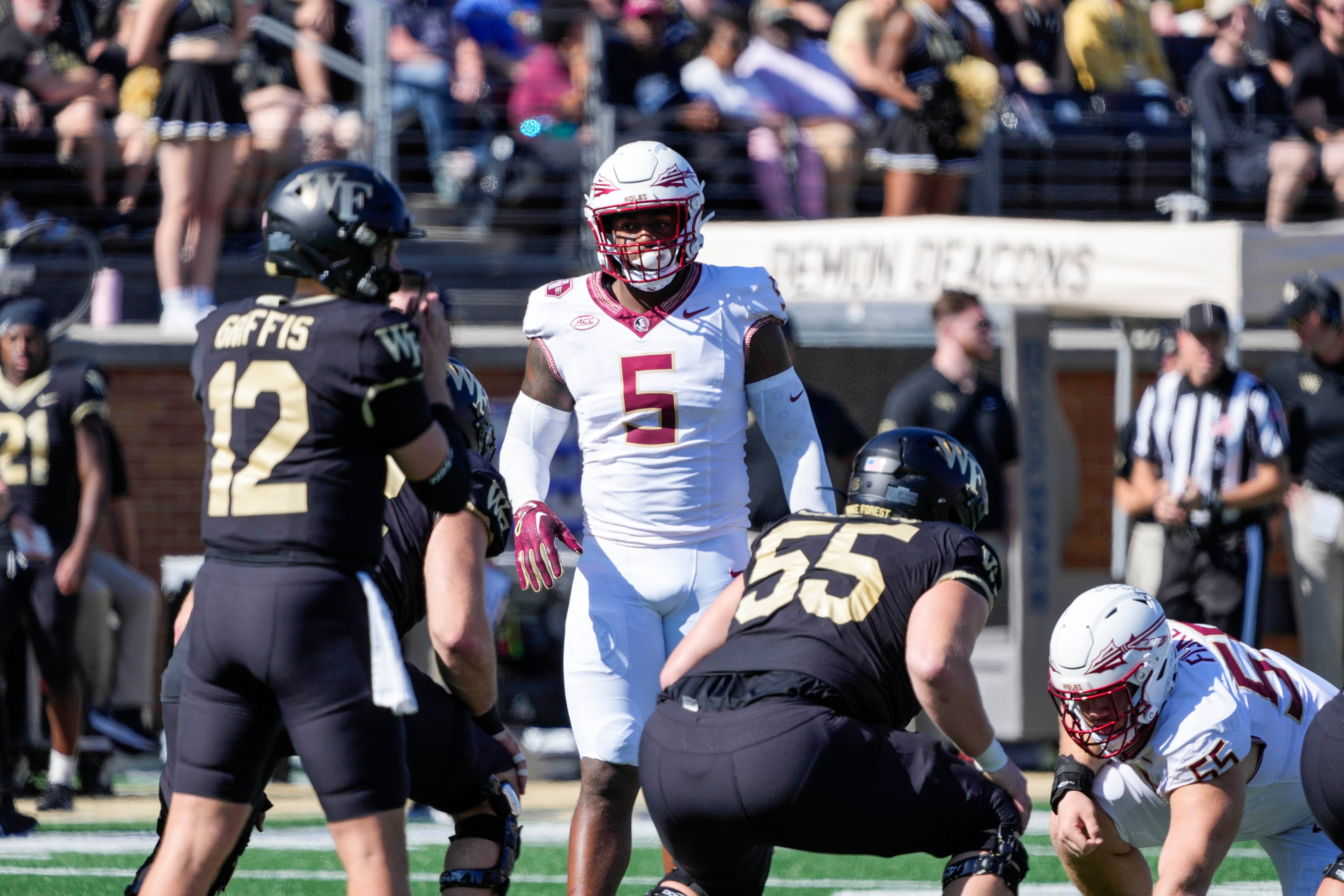 Oct 28, 2023; Winston-Salem, North Carolina, USA; Florida State Seminoles defensive lineman Jared Verse (5) looks over the offense of Wake Forest during the first half at Allegacy Federal Credit Union Stadium. Mandatory Credit: Jim Dedmon-USA TODAY Sports