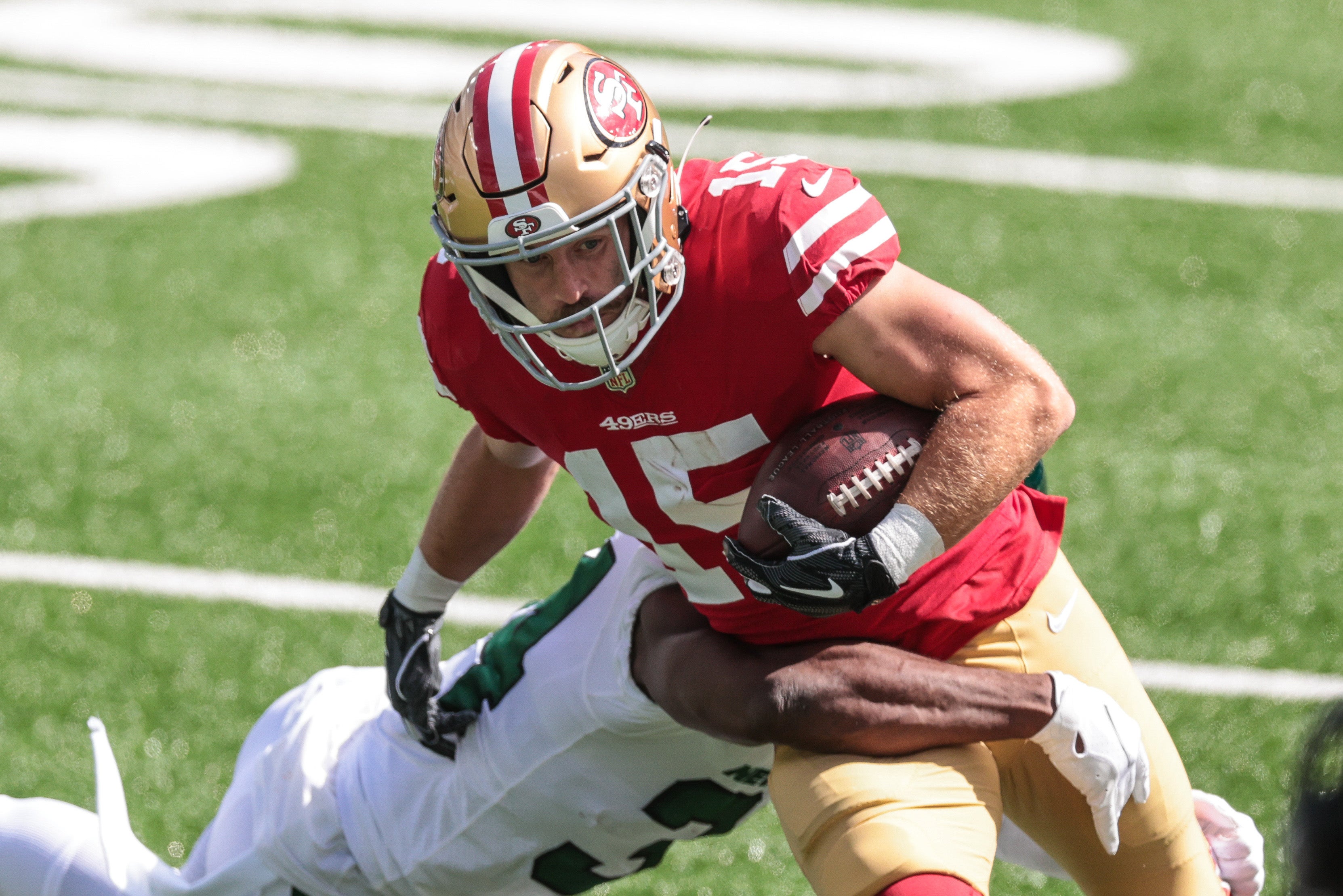 Sep 20, 2020; East Rutherford, New Jersey, USA; San Francisco 49ers wide receiver Trent Taylor (15) is tackled by New York Jets cornerback Brian Poole (34) during the first half at MetLife Stadium.