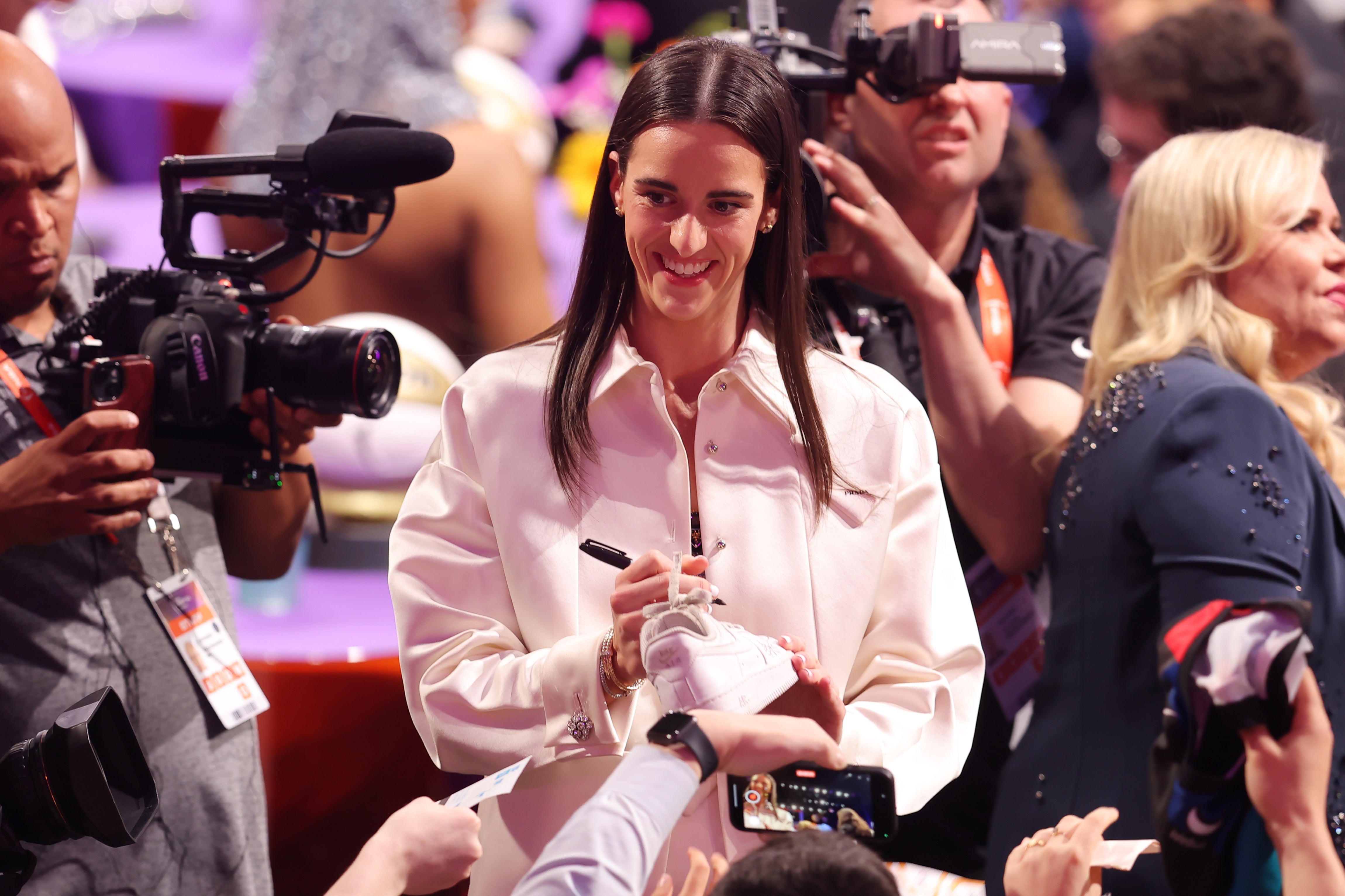 Apr 15, 2024; Brooklyn, NY, USA; Caitlin Clark signs autographs before the 2024 WNBA Draft at Brooklyn Academy of Music.