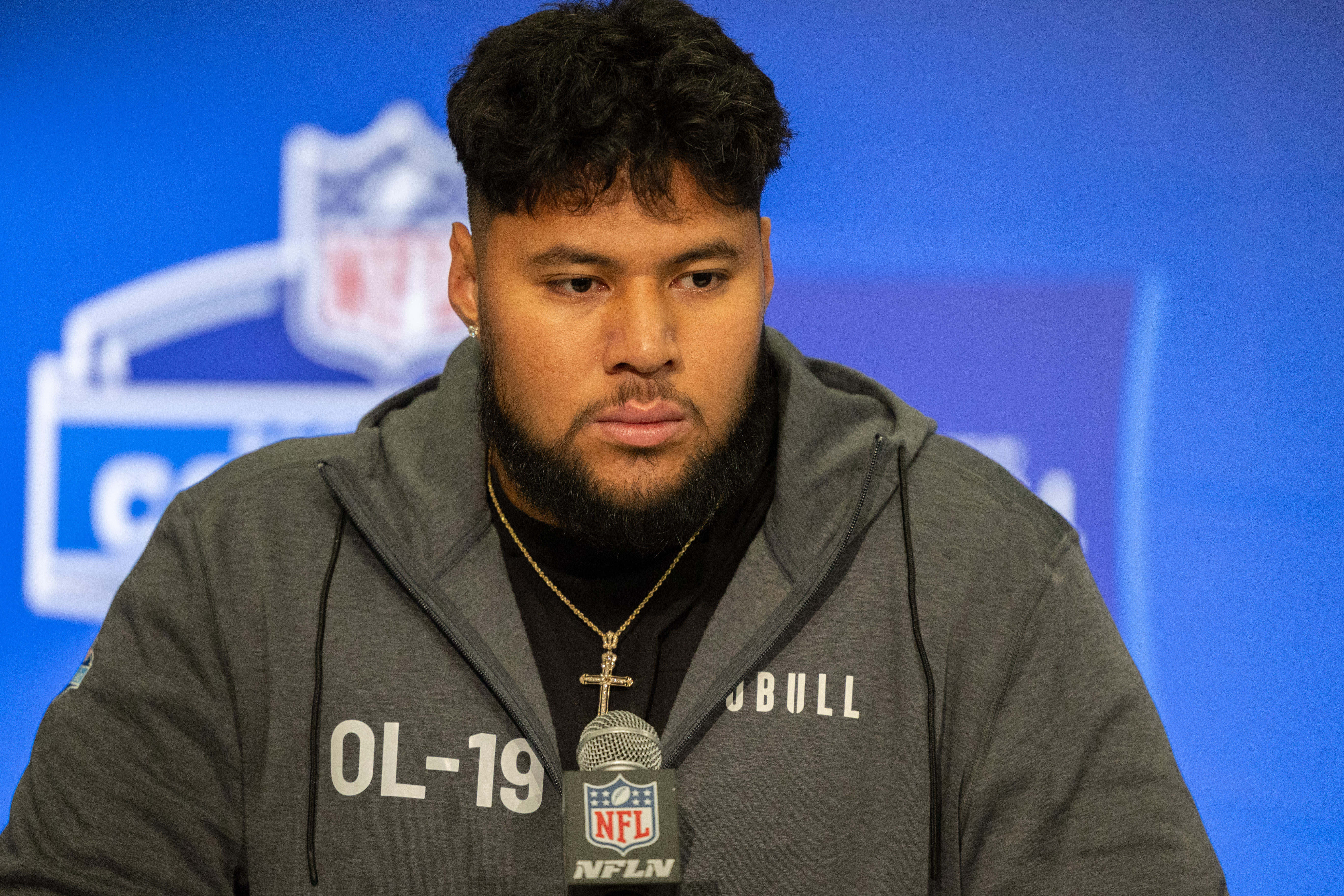 Mar 2, 2024; Indianapolis, IN, USA; Washington offensive lineman Troy Fautanu (OL19) talks to the media during the 2024 NFL Combine at Lucas Oil Stadium.