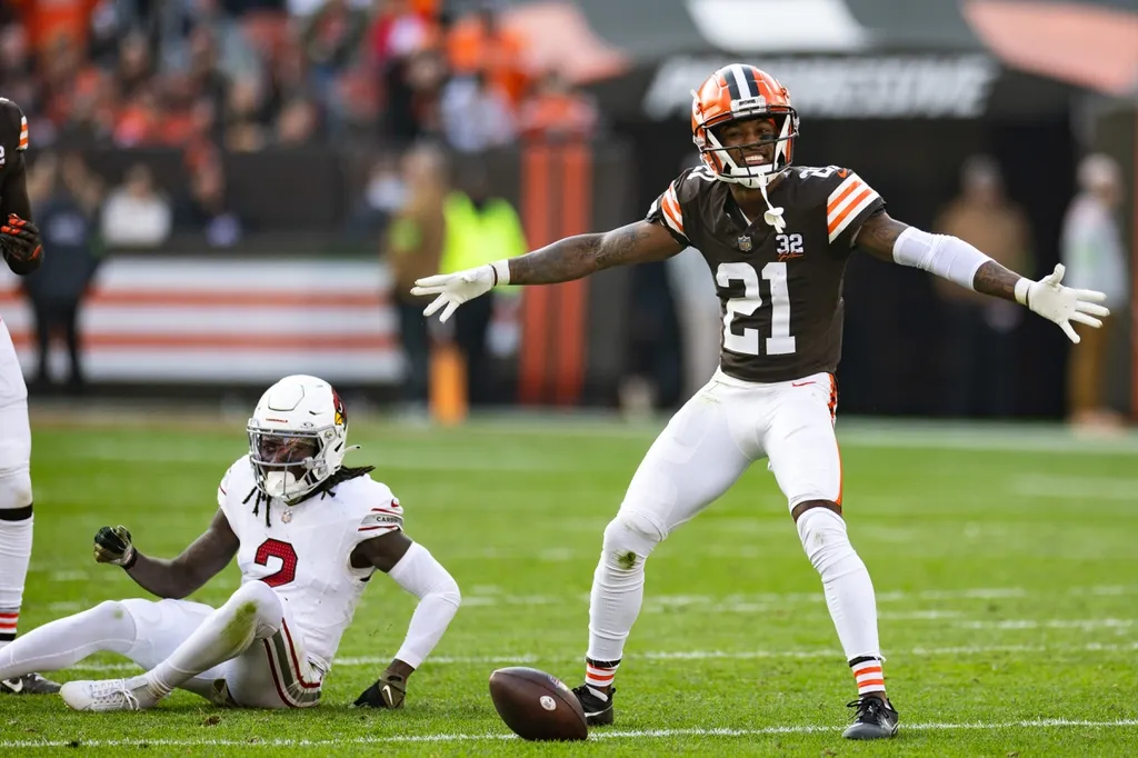 Cleveland Browns cornerback Denzel Ward (21) celebrates his broken up pass intended for Arizona Cardinals wide receiver Marquise Brown (2) during the third quarter at Cleveland Browns Stadium.