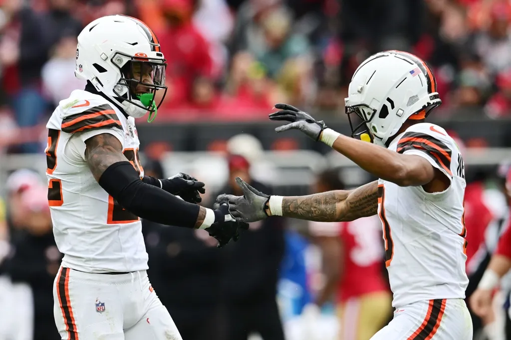 Cleveland Browns safety Grant Delpit (22) and cornerback Greg Newsome II (0) celebrate after play during the second half against the San Francisco 49ers at Cleveland Browns Stadium.