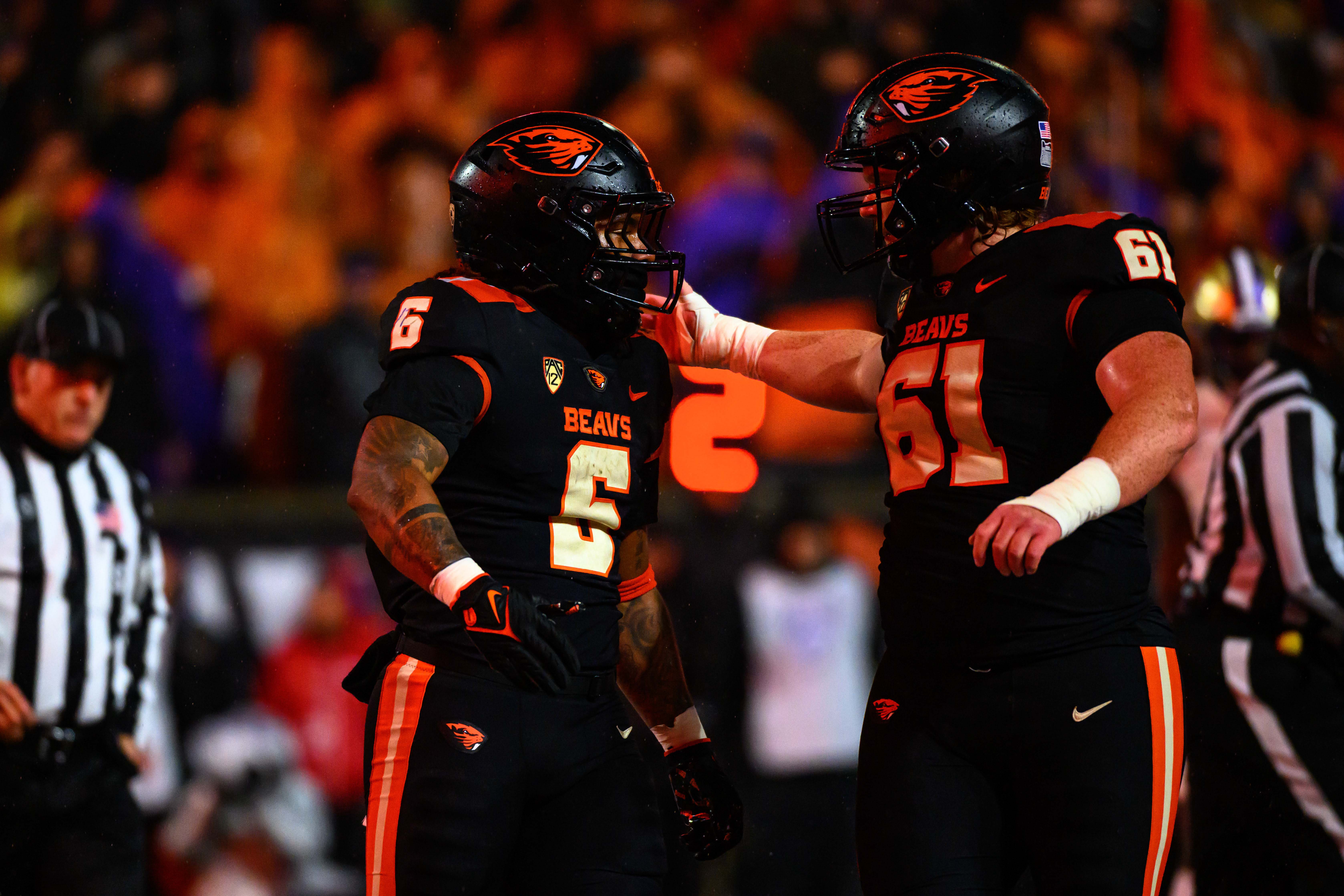 Nov 18, 2023; Corvallis, Oregon, USA; Oregon State Beavers running back Damien Martinez (6) celebrates a touchdown with offensive lineman Tanner Miller (61) during the first half against the Washington Huskies at Reser Stadium.
