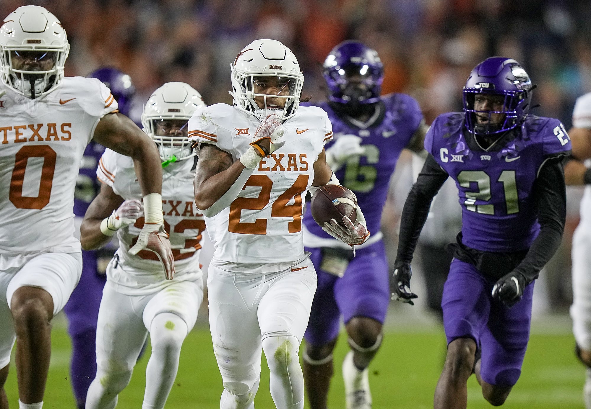 Texas Longhorns running back Jonathon Brooks (24) runs for the first down against TCU Horned Frogs in the first quarter of an NCAA college football game, Saturday, November. 11, 2023, at Amon G. Carter Stadium in Fort Worth, Texas.