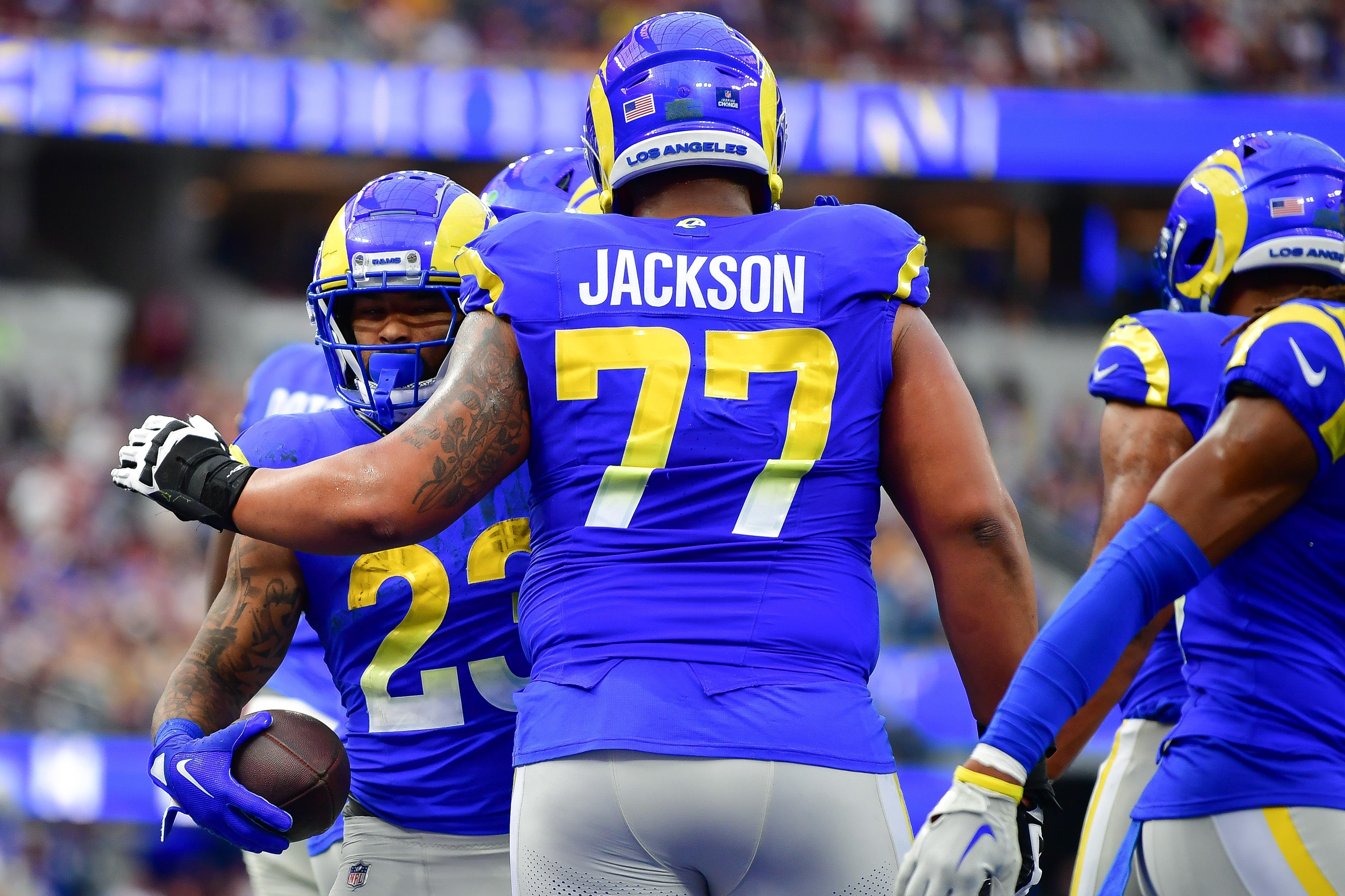 Dec 17, 2023; Inglewood, California, USA; Los Angeles Rams running back Kyren Williams (23) celebrates his touchdown scored against the Washington Commanders with offensive tackle Alaric Jackson (77) during the first half at SoFi Stadium. Mandatory Credit: Gary A. Vasquez-USA TODAY Sports