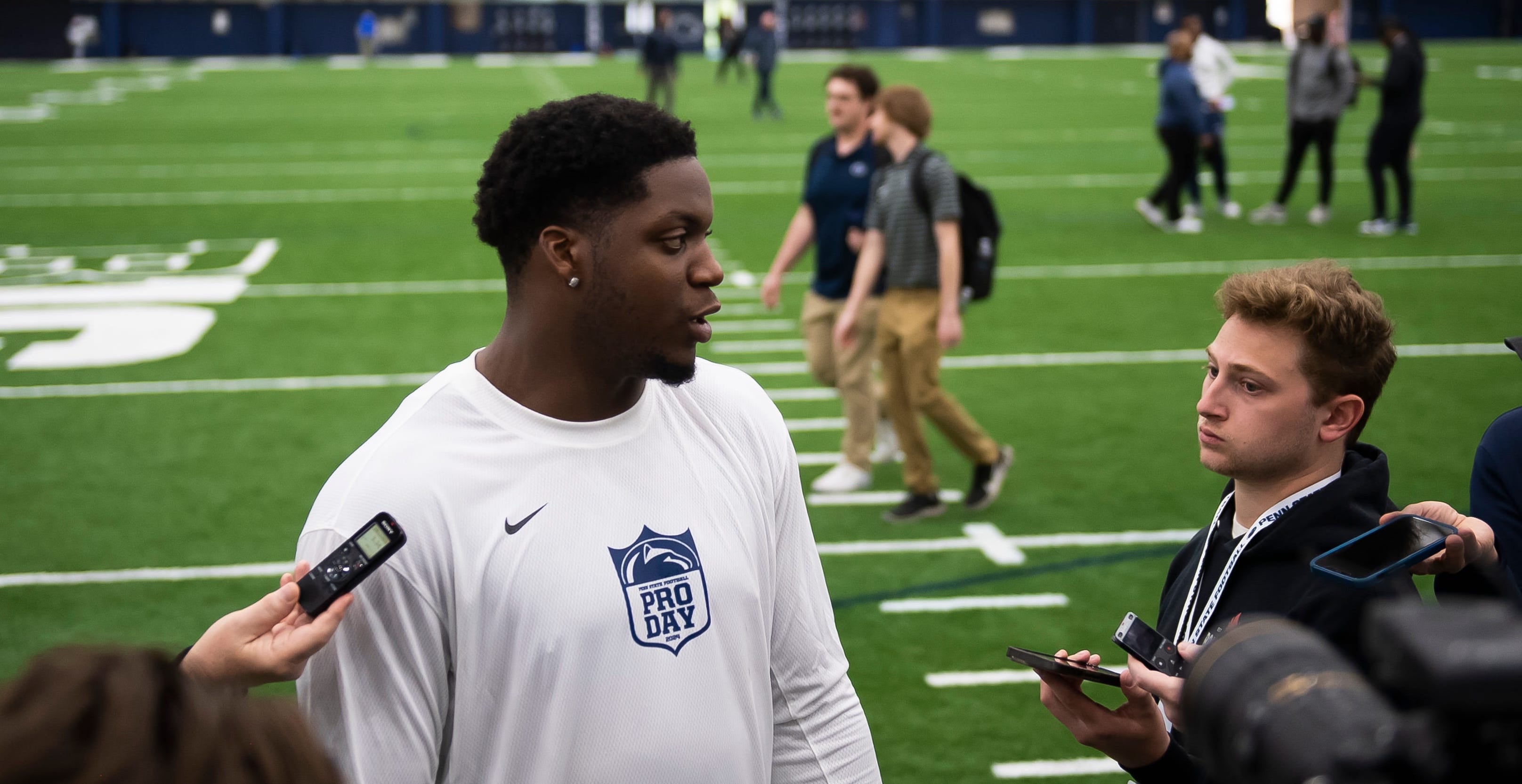 Defensive end Adisa Isaac talks with reporters during Penn State's Pro Day in Holuba Hall on March 15, 2024, in State College.