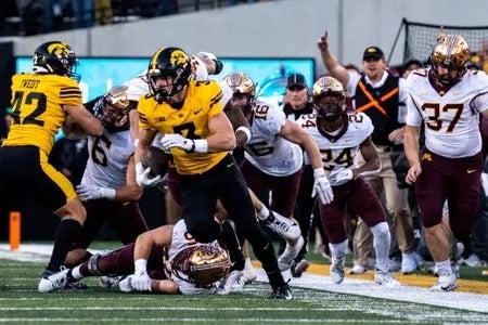 Iowa defensive back Cooper DeJean (3) runs back a punt for a touchdown at Kinnick Stadium on Saturday, October 21, 2023 in Iowa City.
