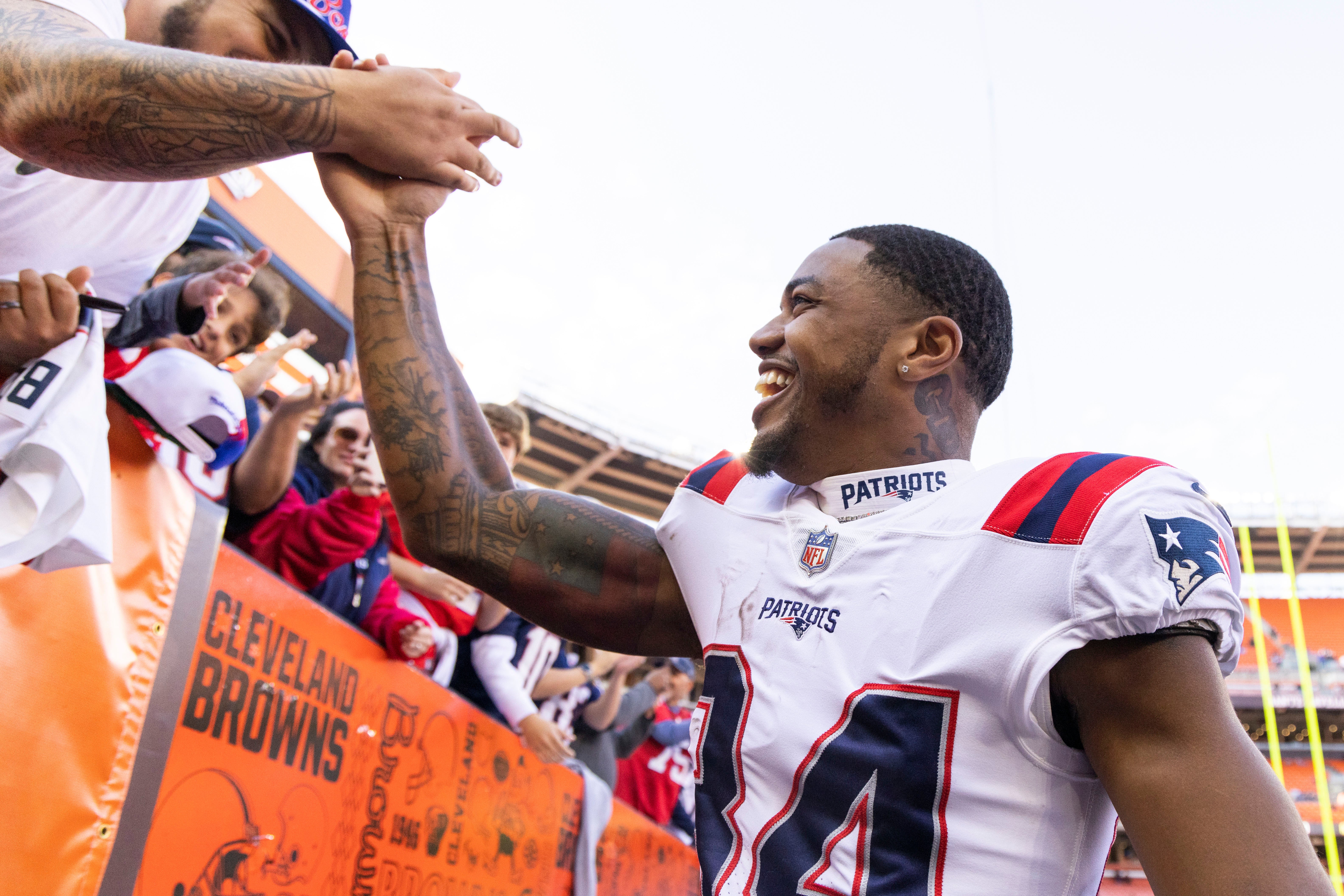 Oct 16, 2022; Cleveland, Ohio, USA; New England Patriots wide receiver Kendrick Bourne (84) slaps hands with fans following the win against the Cleveland Browns at FirstEnergy Stadium.