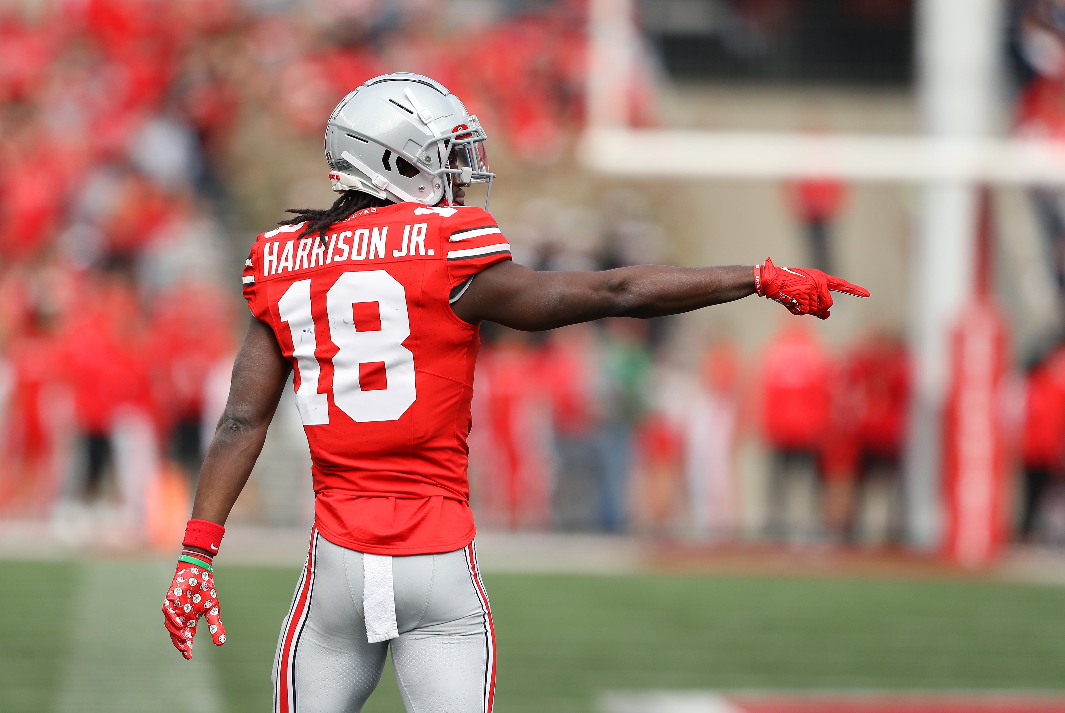 Oct 21, 2023; Columbus, Ohio, USA; Ohio State Buckeyes wide receiver Marvin Harrison Jr. (18) points out a flag that overturned a turnover during the second quarter against the Penn State Nittany Lions at Ohio Stadium.