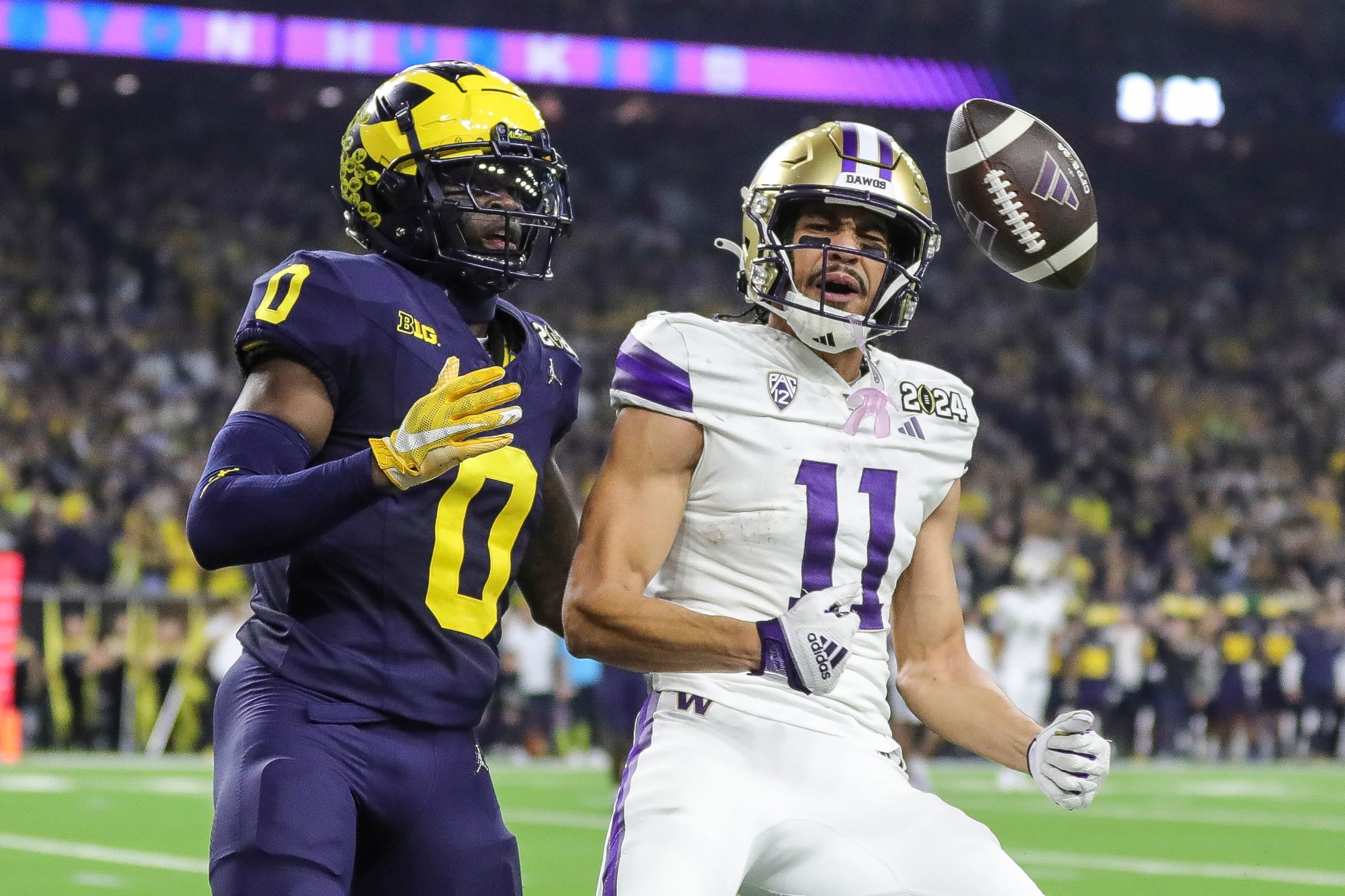 Michigan defensive back Mike Sainristil defends Washington wide receiver Jalen McMillan during the first half of the national championship game at NRG Stadium in Houston, Texas on Monday, Jan. 8, 2024.