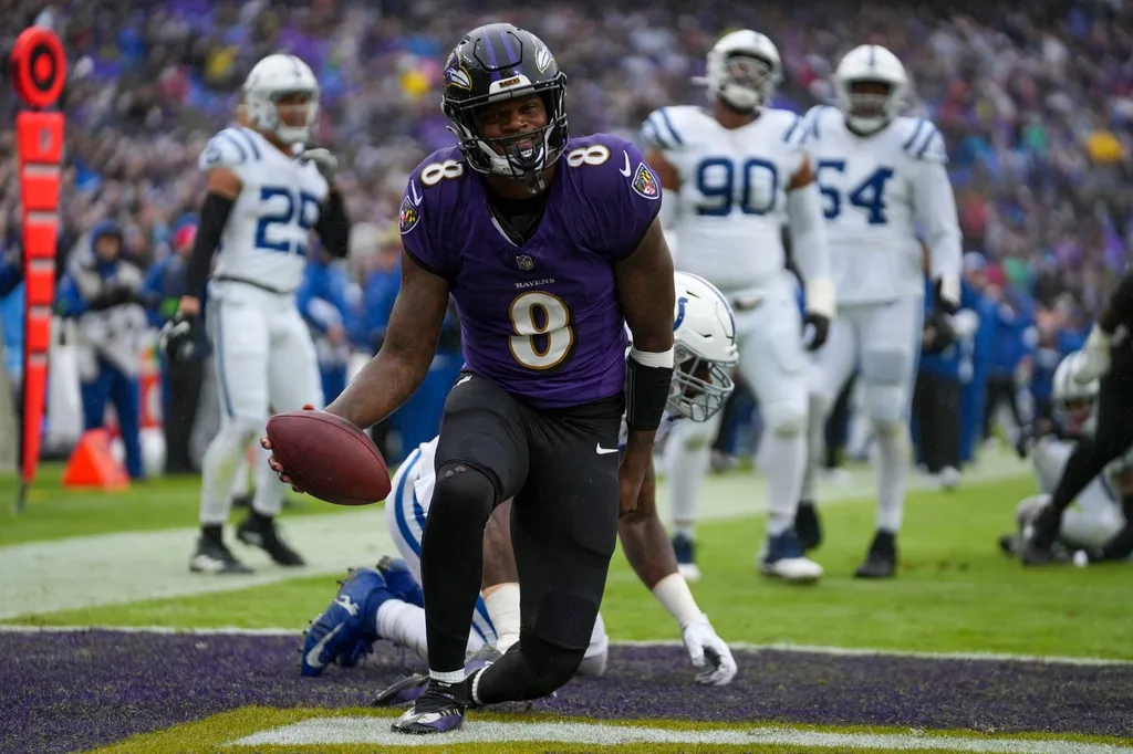 Baltimore Ravens quarterback Lamar Jackson (8) smiles as he comes up with a first quarter touchdown on Sunday, Sept. 24, 2023, at M&T Bank Stadium in Baltimore