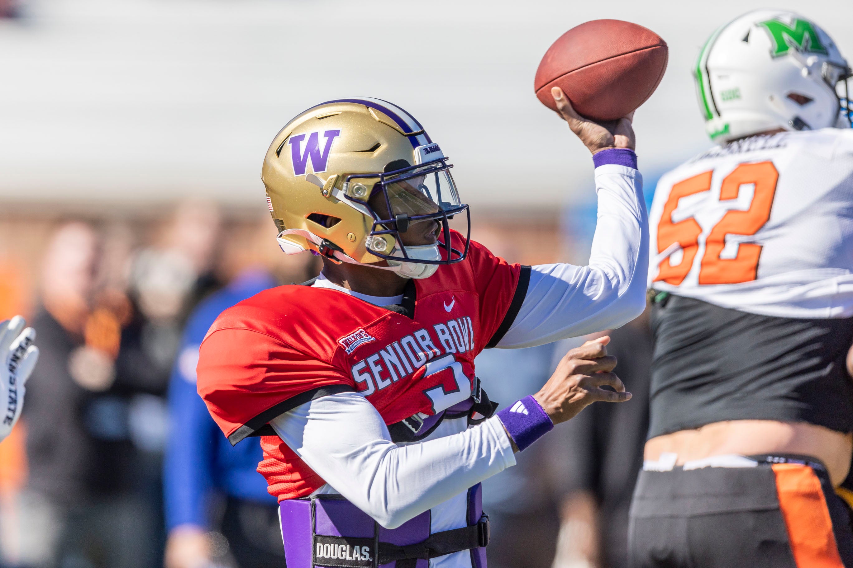 Jan 31, 2024; Mobile, AL, USA; National quarterback Michael Penix Jr of Washington (9) throws the ball during practice for the National team at Hancock Whitney Stadium.