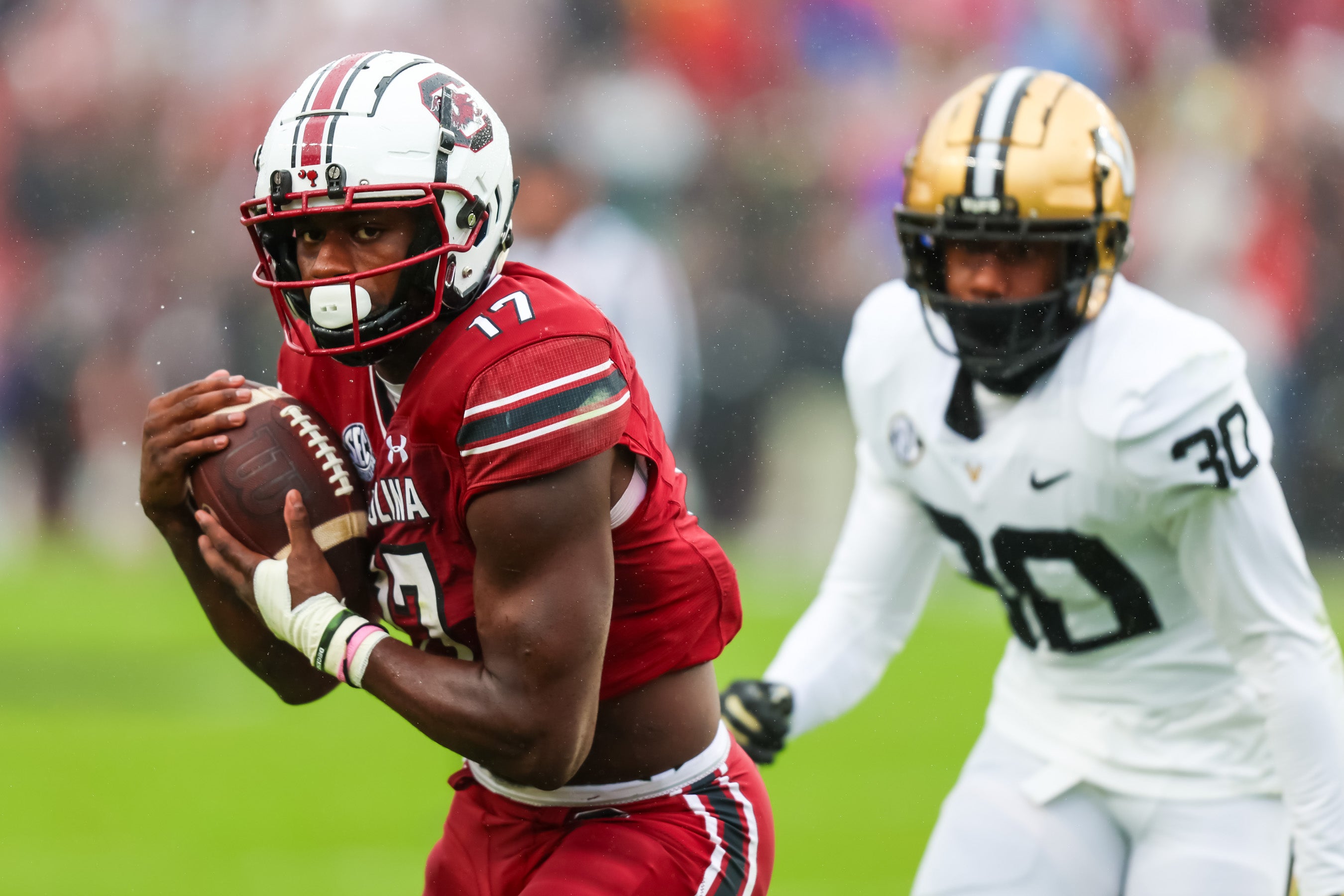Nov 11, 2023; Columbia, South Carolina, USA; South Carolina Gamecocks wide receiver Xavier Legette (17) makes a reception against Vanderbilt Commodores cornerback Trudell Berry (30) in the first quarter at Williams-Brice Stadium.