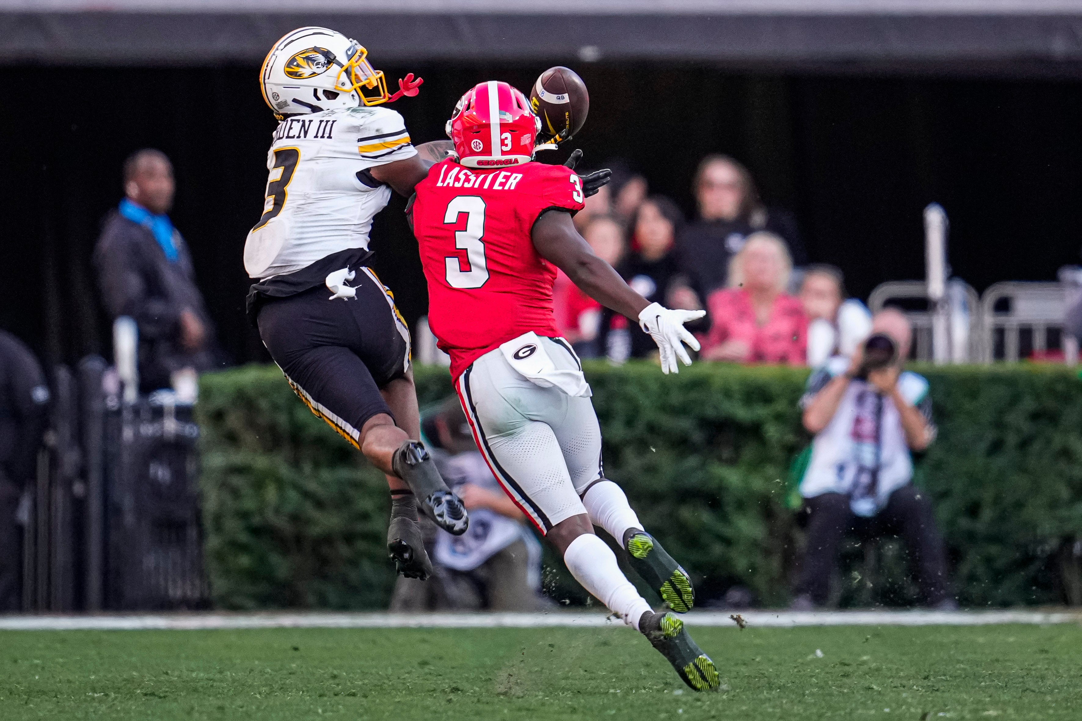 Nov 4, 2023; Athens, Georgia, USA; Georgia Bulldogs defensive back Kamari Lassiter (3) breaks up a pass intended for Missouri Tigers wide receiver Luther Burden III (3) during the second half at Sanford Stadium. Mandatory Credit: Dale Zanine-USA TODAY Sports