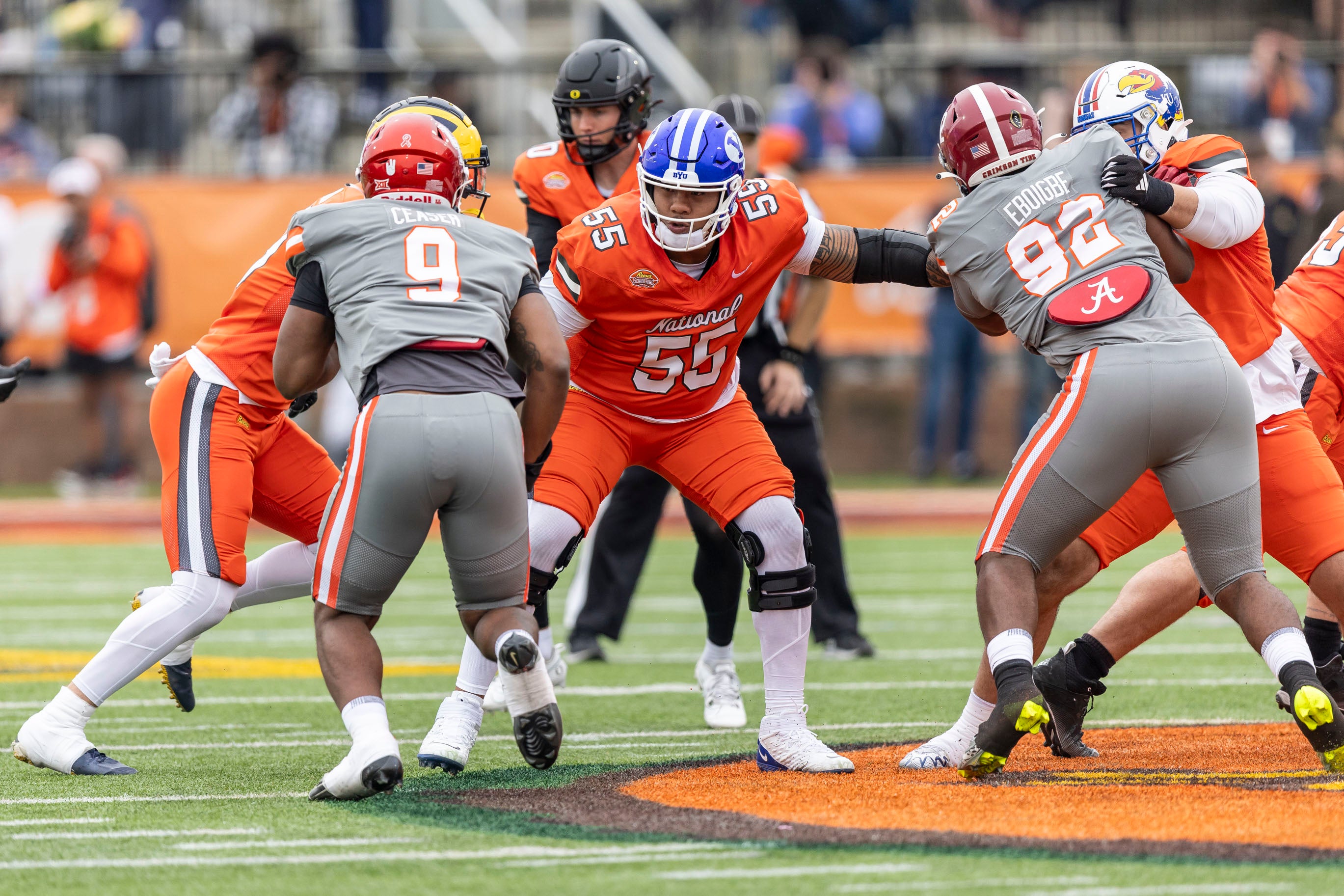 Feb 3, 2024; Mobile, AL, USA; National offensive lineman Kingsley Suamataia of BYU (55) blocks during the first half of the 2024 Senior Bowl football game at Hancock Whitney Stadium.