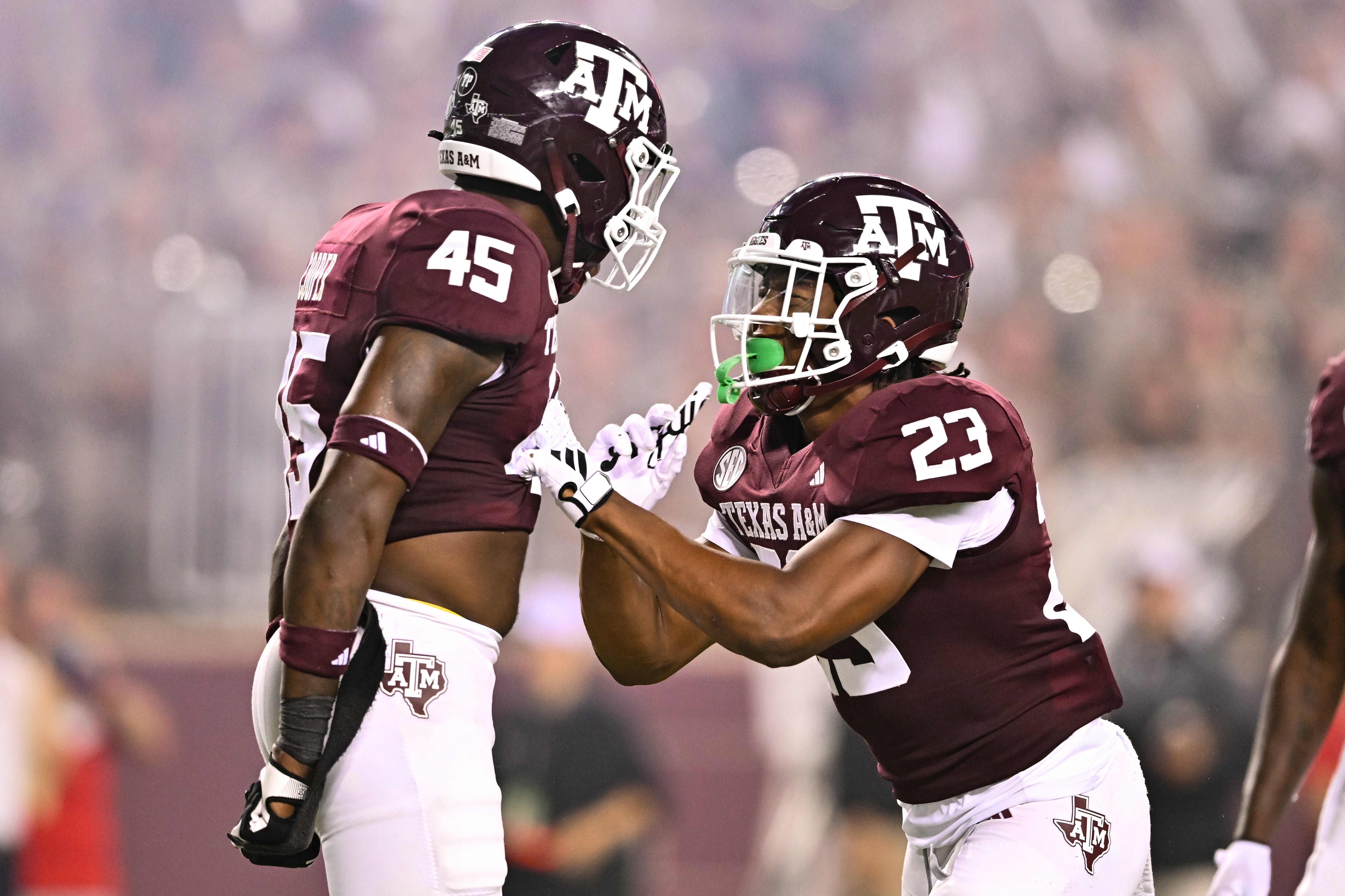 Texas A&M Aggies linebacker Chantz Johnson (23) and linebacker Edgerrin Cooper (45) react to a play during the third quarter against New Mexico Lobos at Kyle Field.