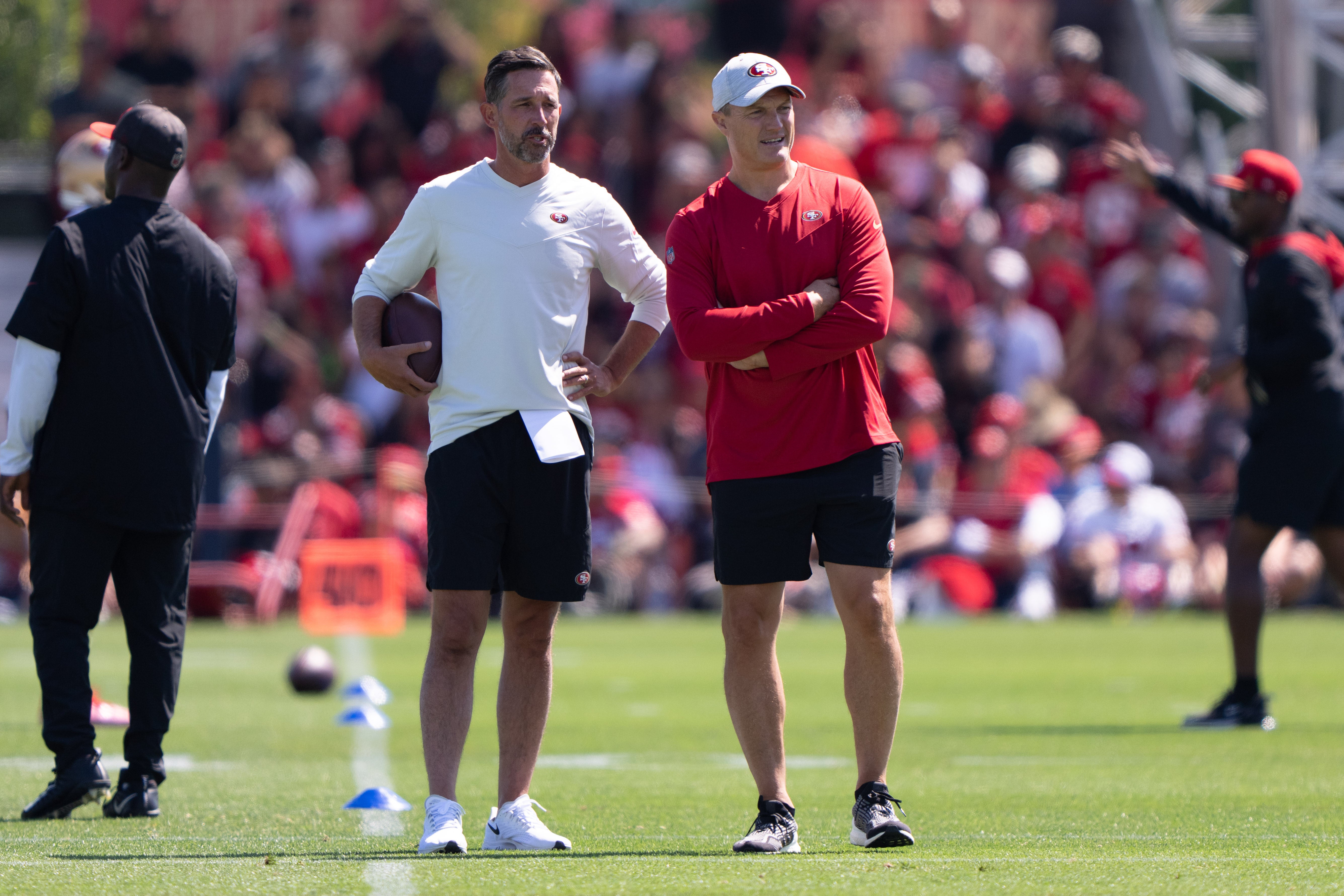 Jul 27, 2022; Santa Clara, CA, USA; San Francisco 49ers head coach Kyle Shanahan (left) and general manager John Lynch watches the players during Training Camp at the SAP Performance Facility near Levi Stadium.