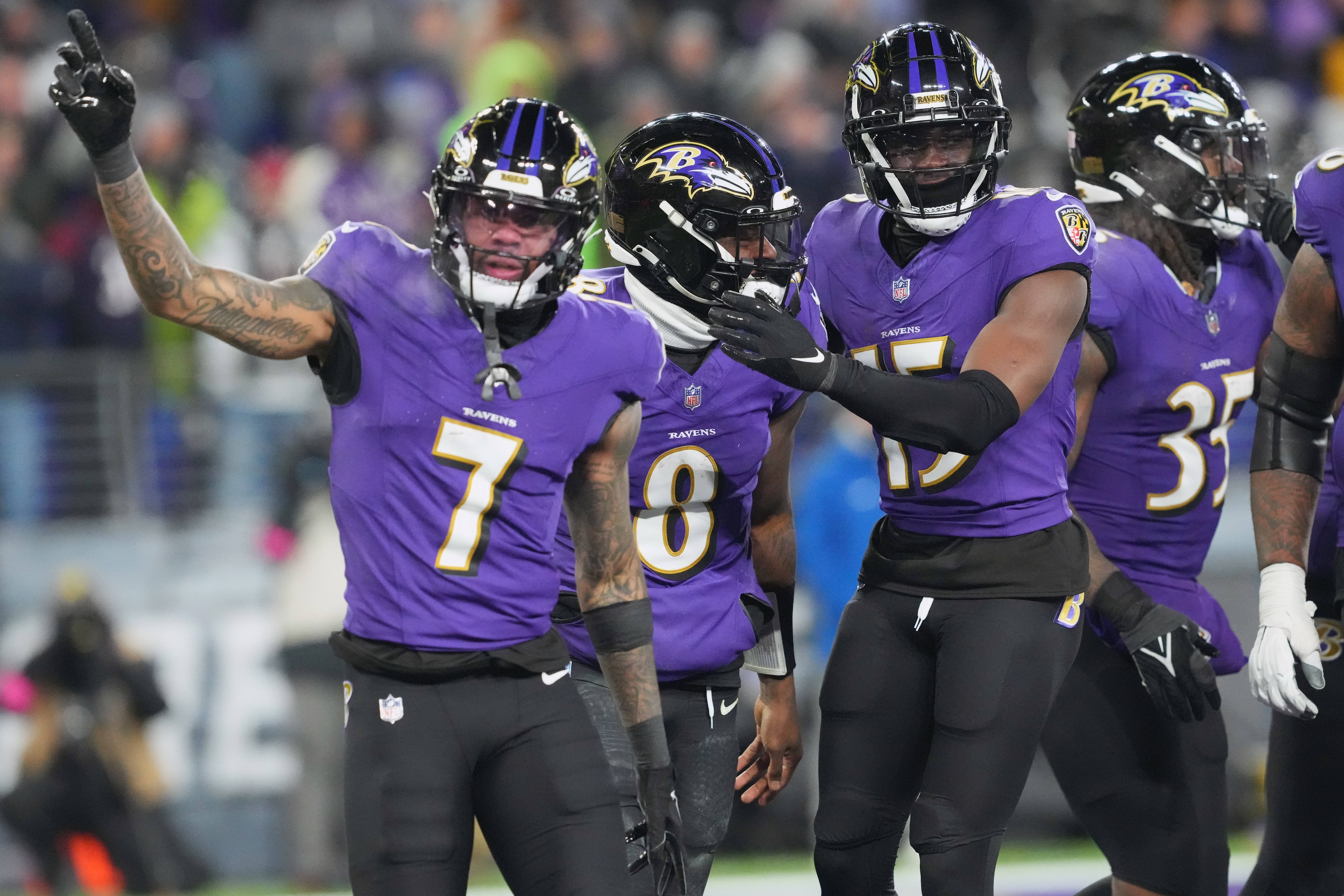 Jan 20, 2024; Baltimore, MD, USA; Baltimore Ravens quarterback Lamar Jackson (8) celebrates with wide receiver Rashod Bateman (7) and wide receiver Nelson Agholor (15) after scoring a touchdown against the Houston Texans during the third quarter of a 2024 AFC divisional round game at M&T Bank Stadium. Mandatory Credit: Mitch Stringer-USA TODAY Sports  