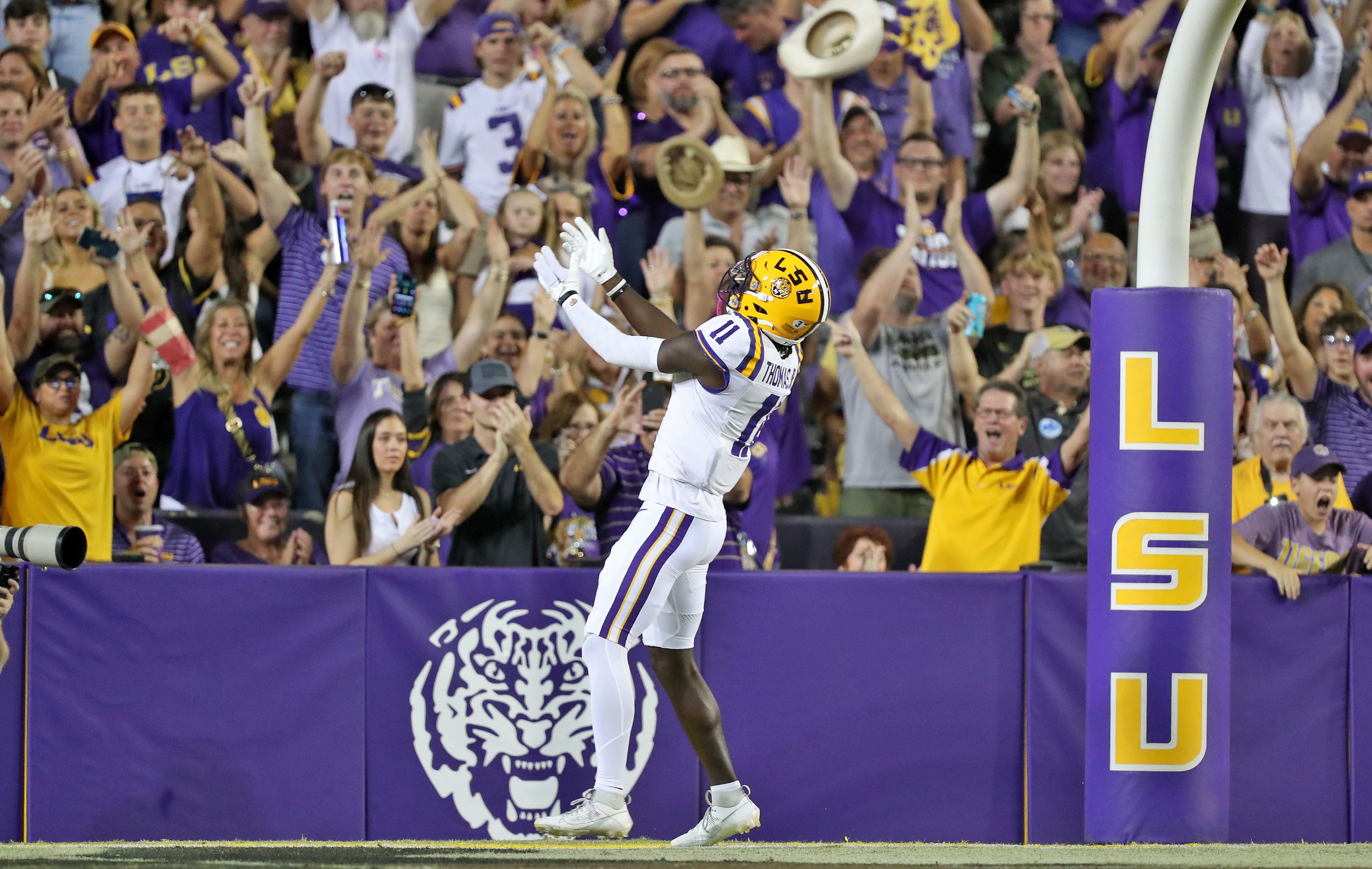 Oct 21, 2023; Baton Rouge, Louisiana, USA; LSU Tigers wide receiver Brian Thomas Jr. (11) celebrates his touchdown against the Army Black Knights during the first half at Tiger Stadium.