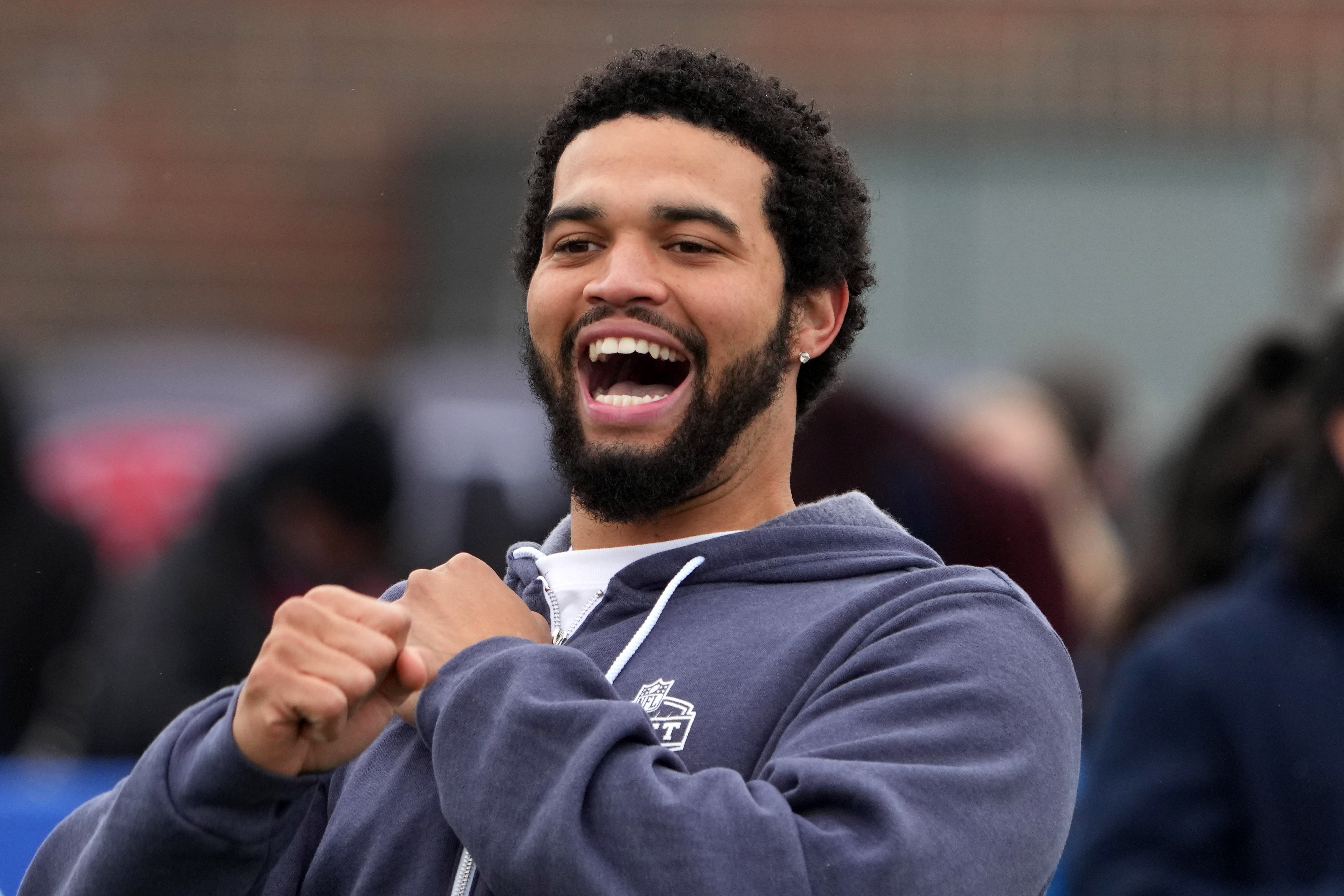 Apr 24, 2024; Detroit, MI, USA; Southern California Trojans quarterback Caleb Williams reacts at the Play Football Prospect Clinic at The Corner Ballpark.