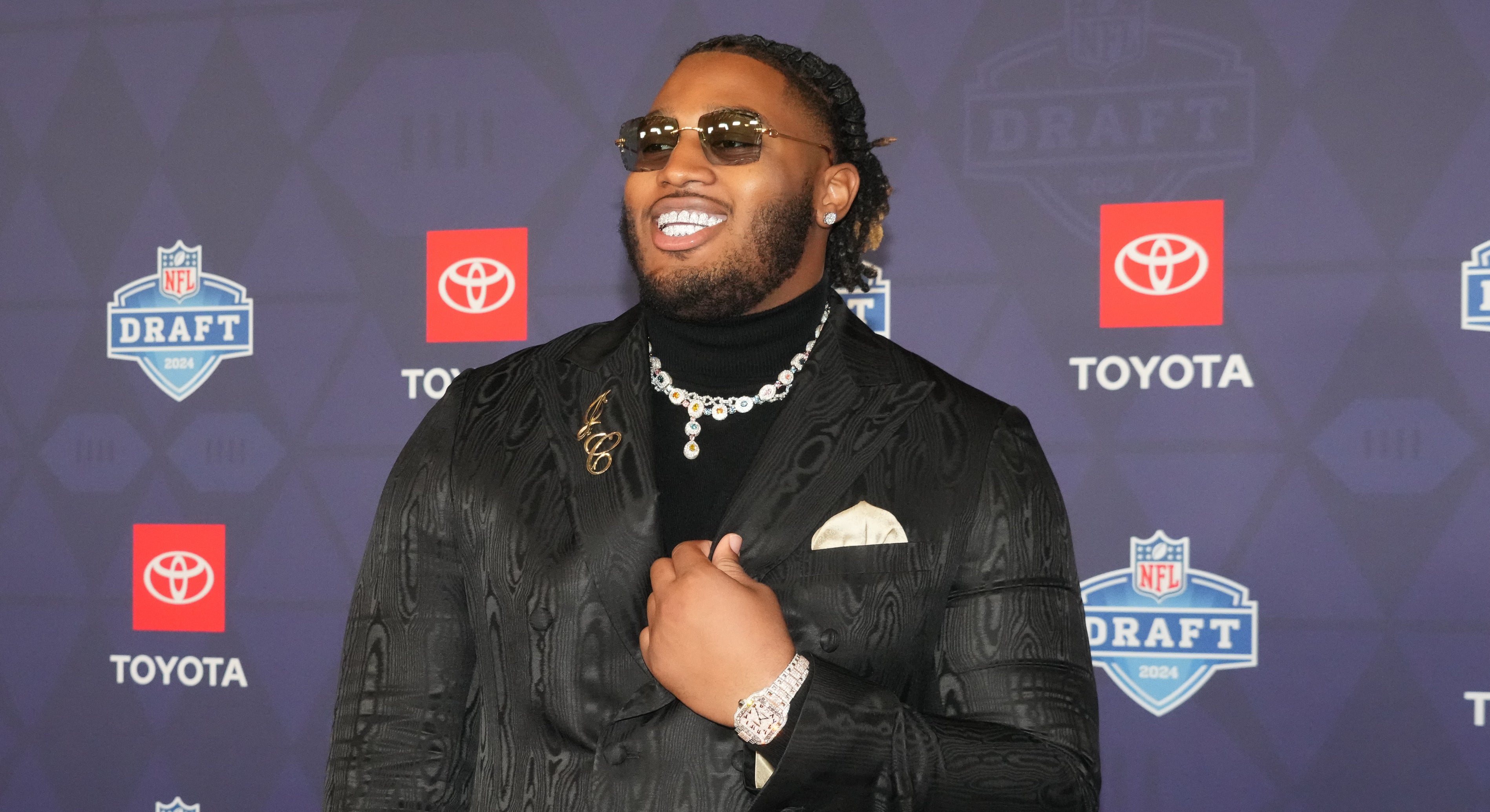 Alabama Crimson Tide offensive lineman JC Latham stands on the red carpet ahead of the 2024 NFL Draft at Detroits Fox Theatre. Kirby Lee-USA TODAY Sports