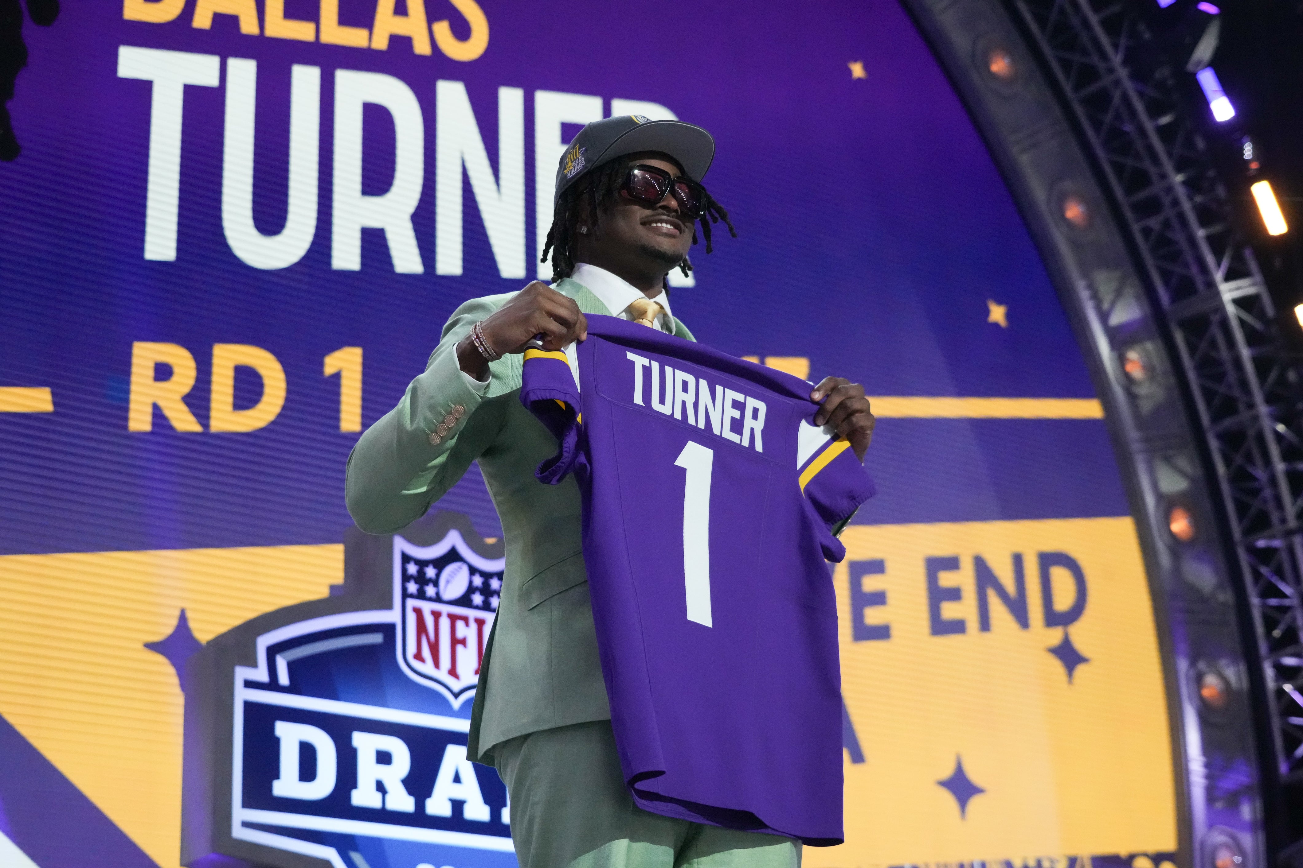 Apr 25, 2024; Detroit, MI, USA; Alabama Crimson Tide linebacker Dallas Turner poses after being selected by the Minnesota Vikings as the No. 17 pick in the first round of the 2024 NFL Draft at Campus Martius Park and Hart Plaza.