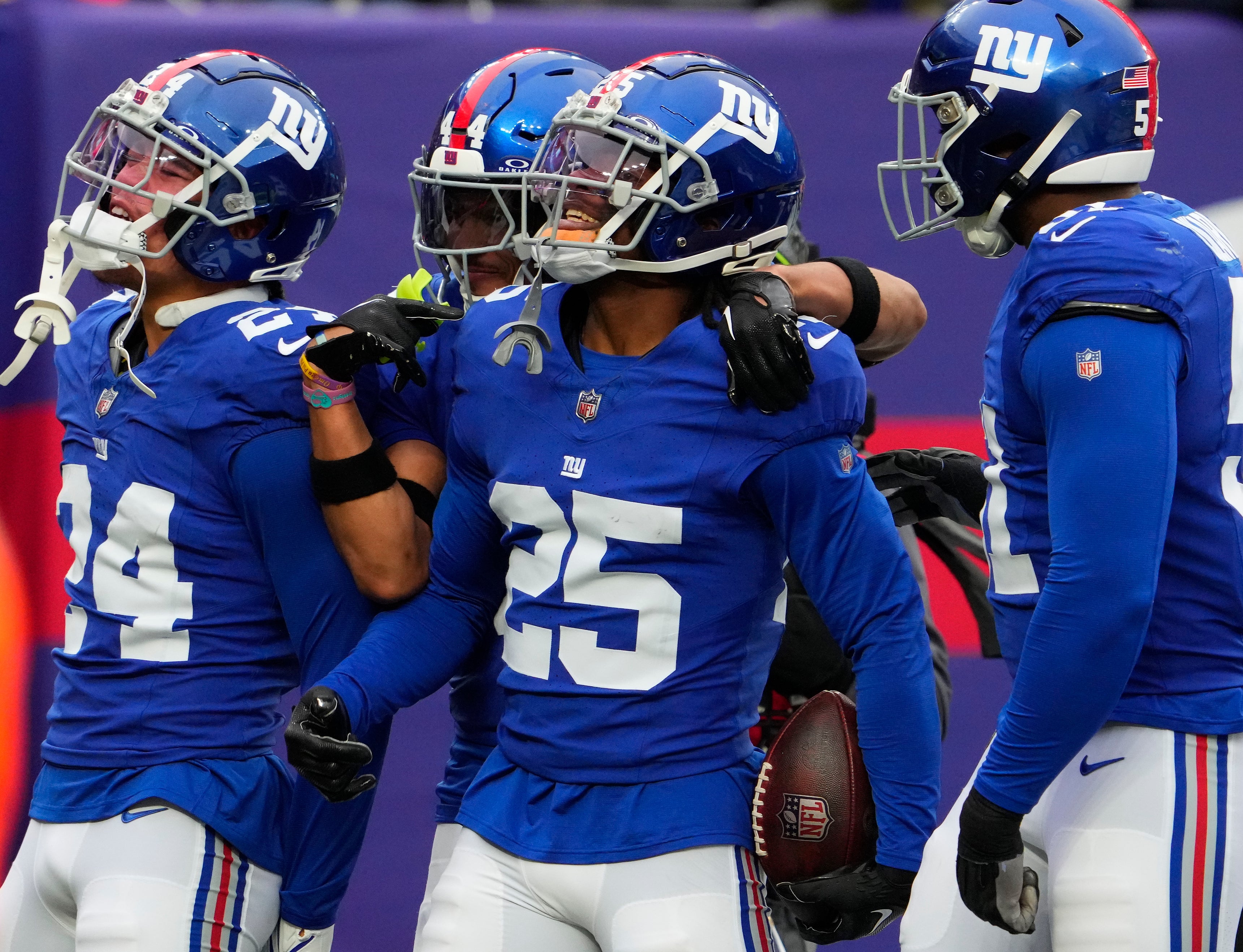 Nov 26, 2023; East Rutherford, New Jersey, USA; New York Giants cornerback Deonte Banks (25) celebrates an interception against New England Patriots in the 1st half at MetLife Stadium.