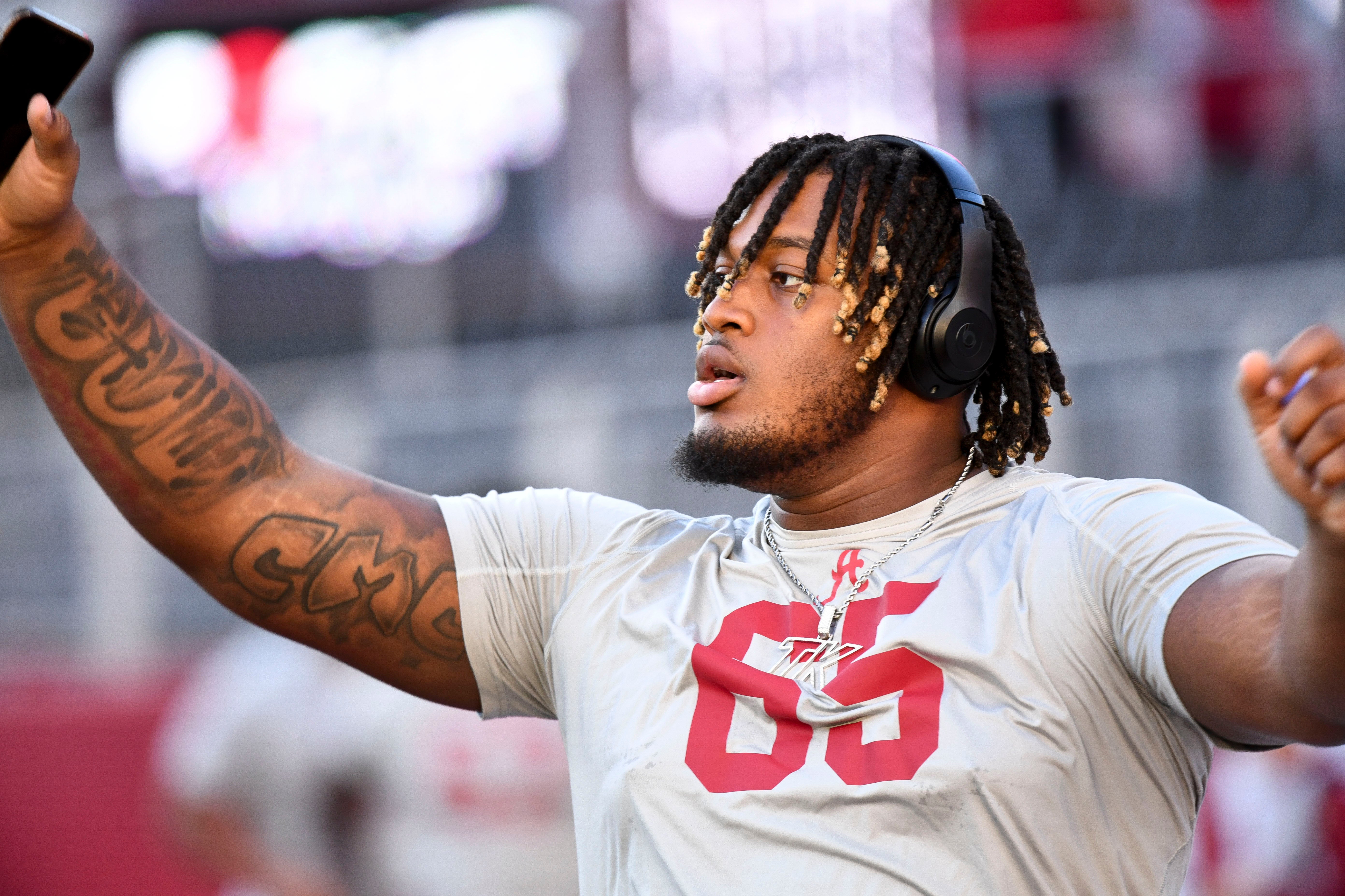 Alabama Crimson Tide offensive lineman JC Latham (65) stretches on the field before a game against the LSU Tigers at Bryant-Denny Stadium. Gary Cosby Jr.-USA TODAY Sports