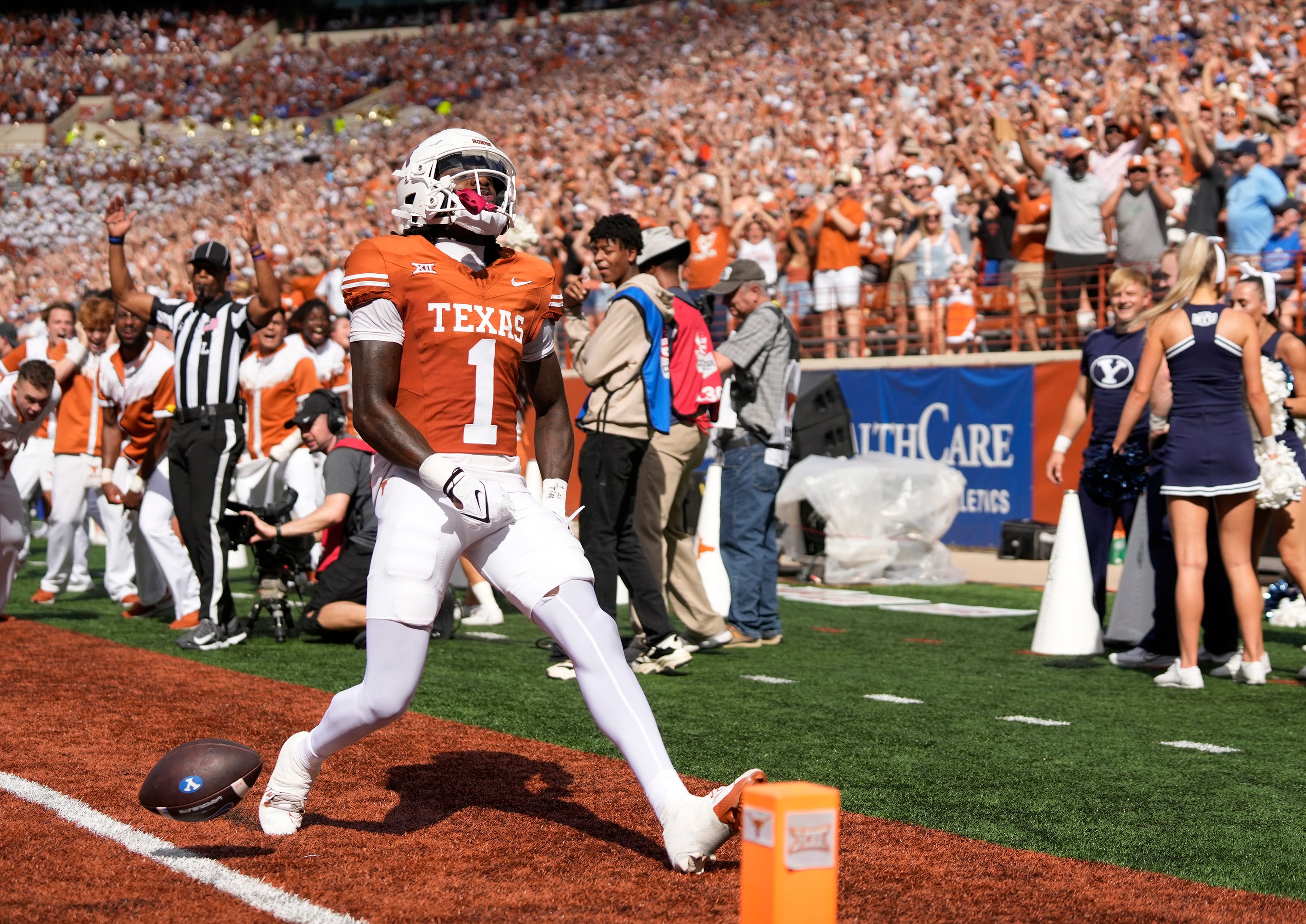 Texas Longhorns punt returner Xavier Worthy scores a touchdown on a punt return against the BYU Cougars in the first quarter at Royal-Memorial Stadium on Saturday October 28, 2023.  