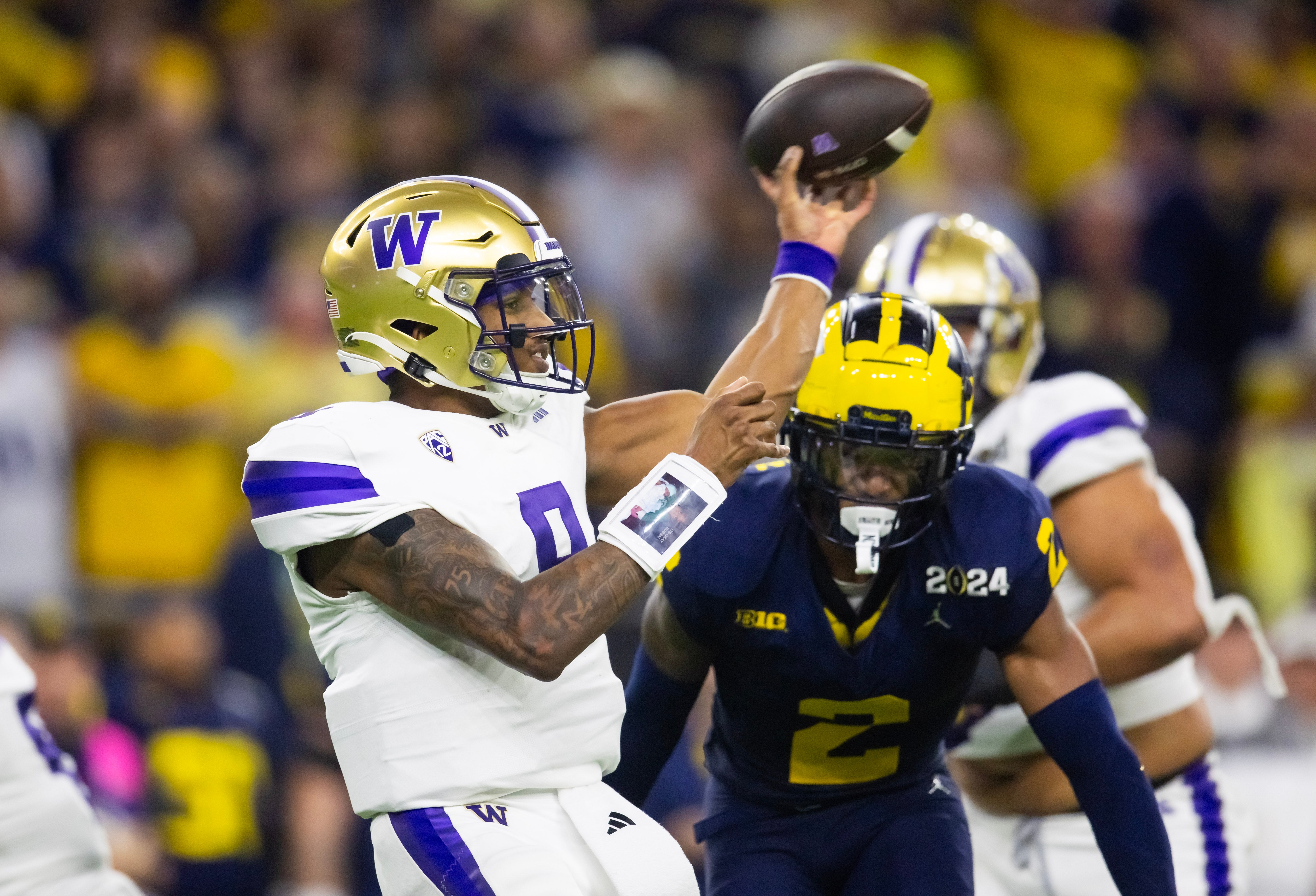 Jan 8, 2024; Houston, TX, USA; Washington Huskies quarterback Michael Penix Jr. (9) against the Michigan Wolverines during the 2024 College Football Playoff national championship game at NRG Stadium.