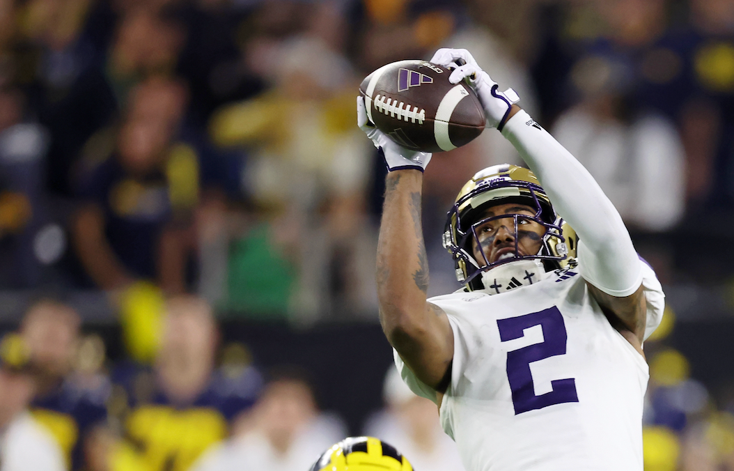 Jan 8, 2024; Houston, TX, USA; Washington Huskies wide receiver Ja'Lynn Polk (2) makes a catch against the Michigan Wolverines during the fourth quarter in the 2024 College Football Playoff national championship game at NRG Stadium.