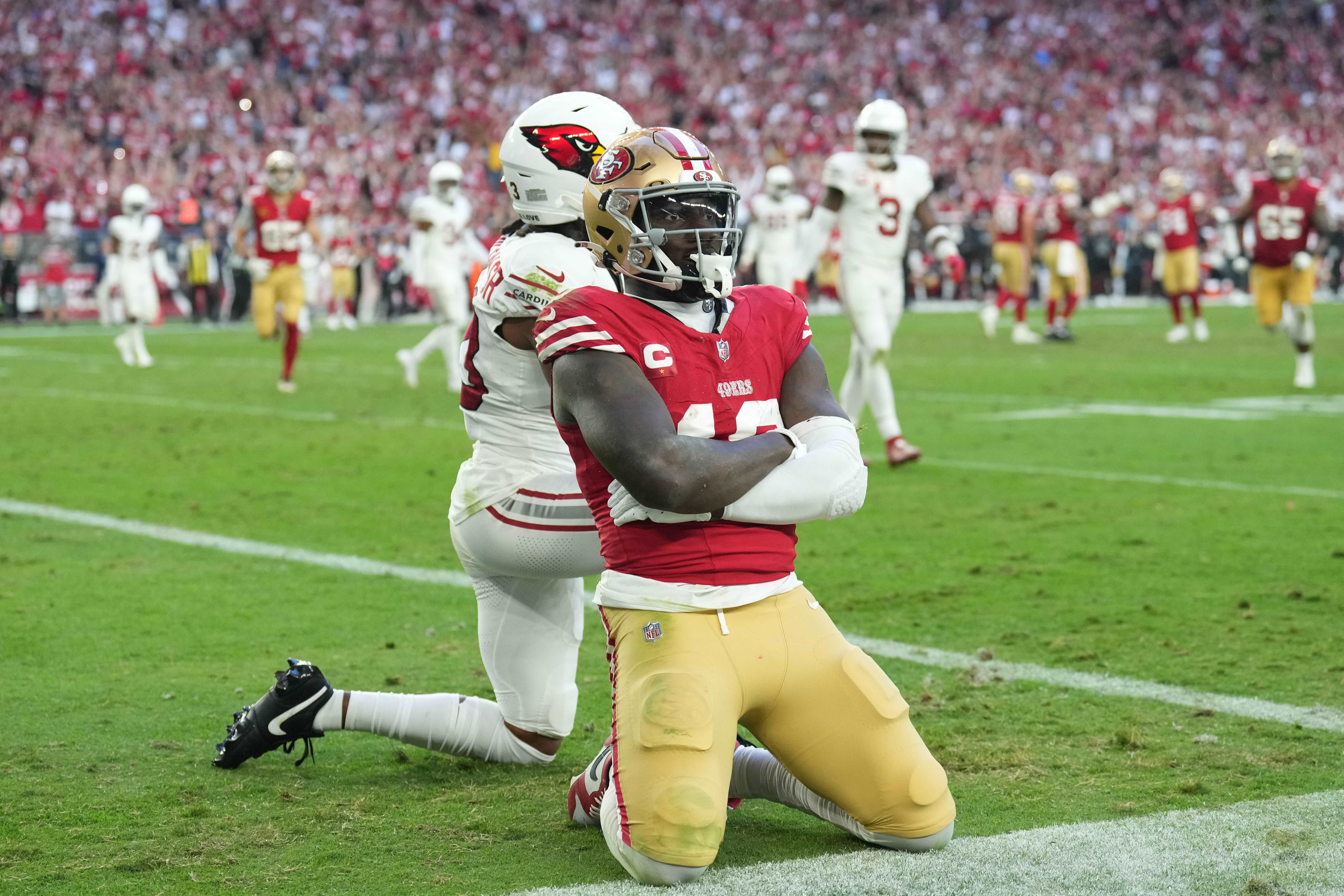 Dec 17, 2023; Glendale, Arizona, USA; San Francisco 49ers wide receiver Deebo Samuel (19) celebrates a touchdown against the Arizona Cardinals during the second half at State Farm Stadium.