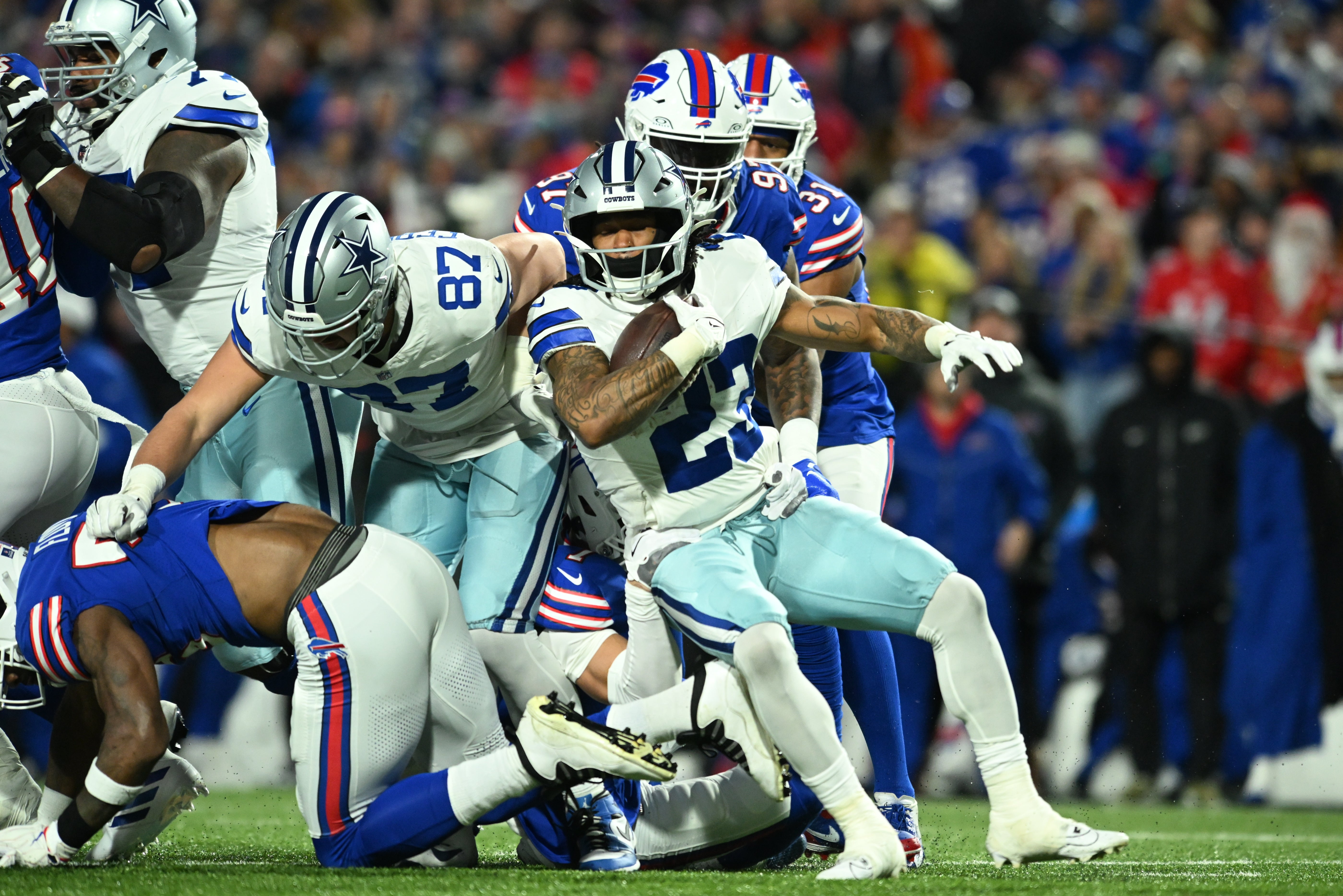 Dallas Cowboys running back Rico Dowdle (23) plays the ball in the first half against the Buffalo Bills at Highmark Stadium.
