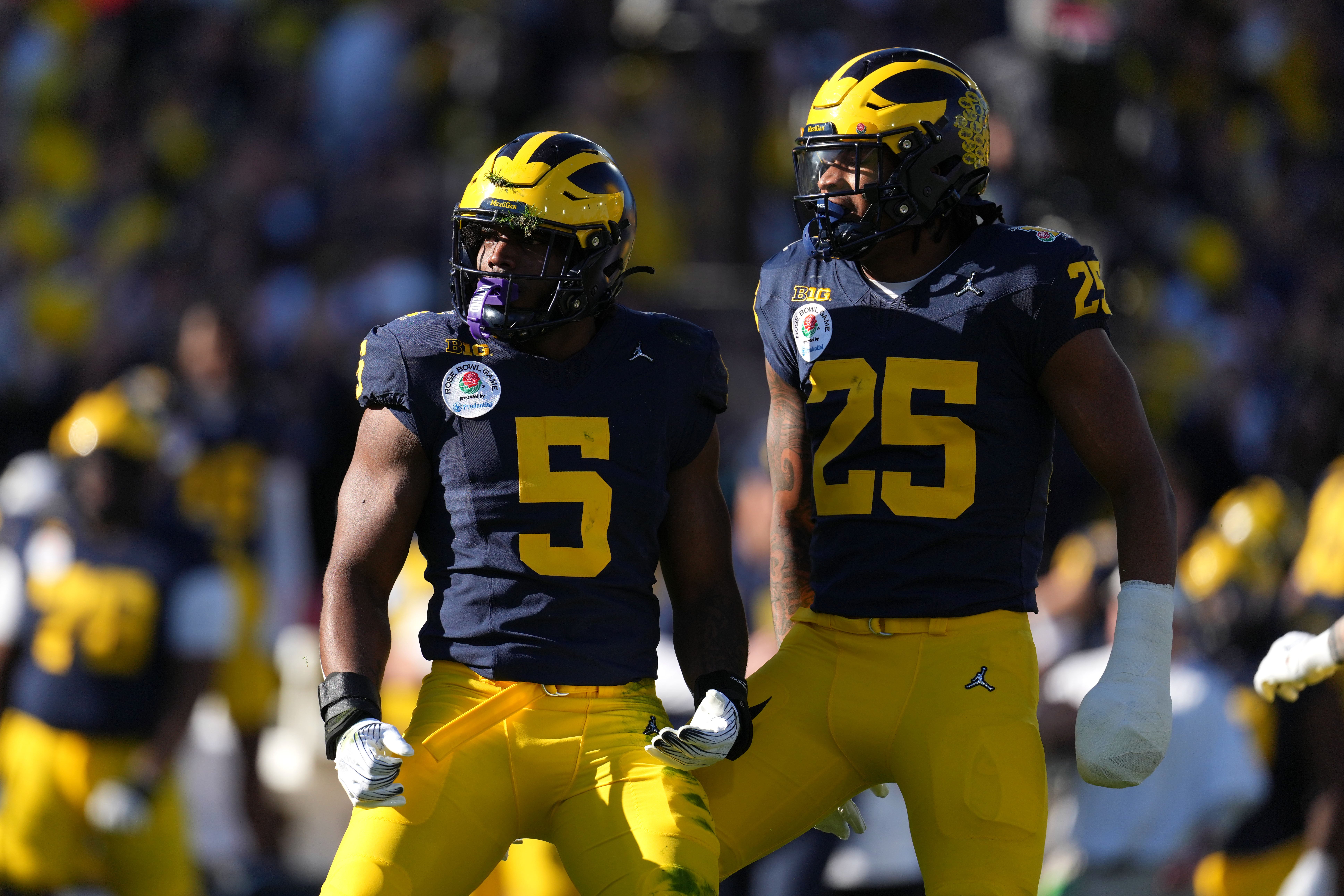 Jan 1, 2024; Pasadena, CA, USA; Michigan Wolverines defensive end Josaiah Stewart (5) and linebacker Junior Colson (25) react during the first half against the Alabama Crimson Tide in the 2024 Rose Bowl college football playoff semifinal game at Rose Bowl.