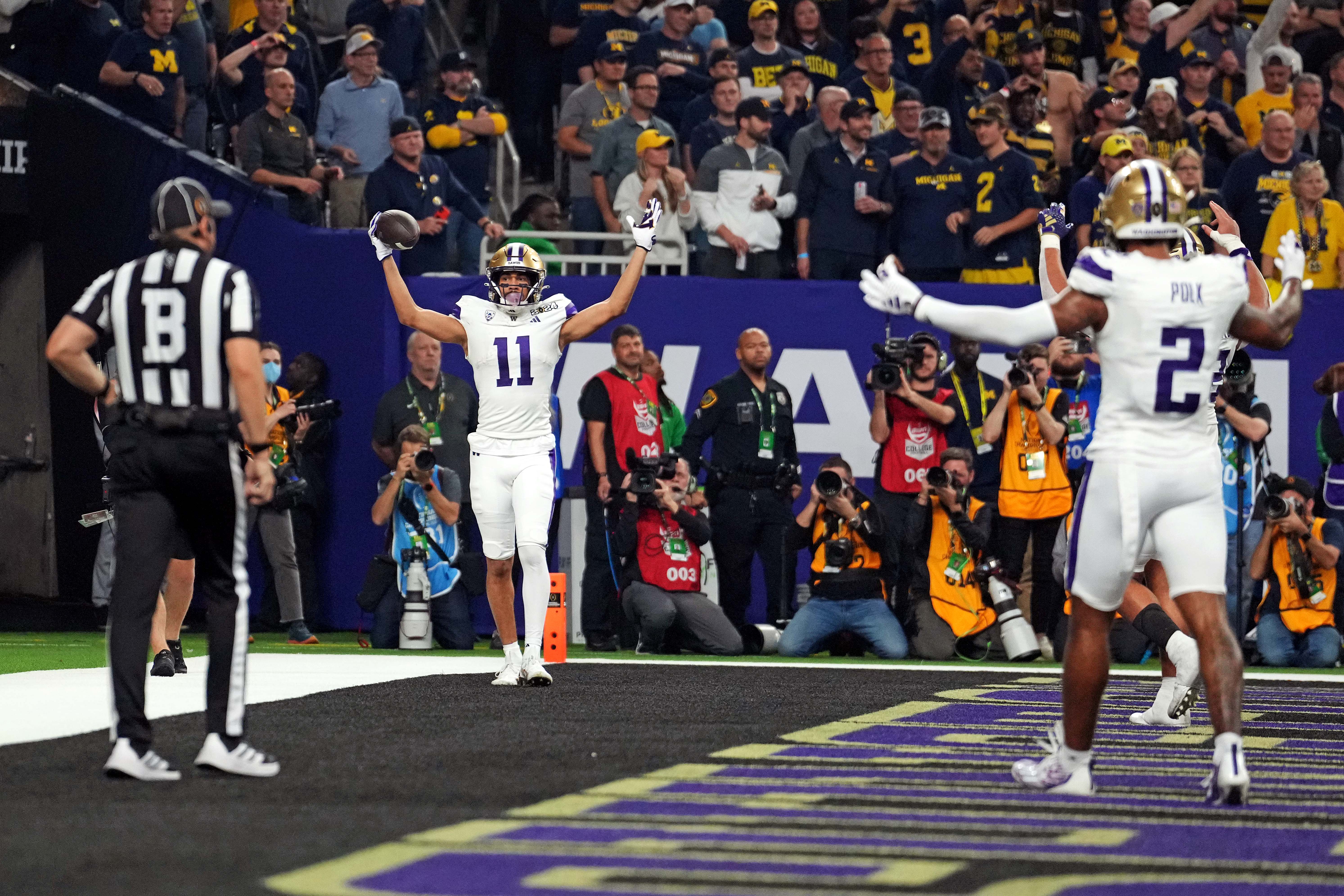 Jan 8, 2024; Houston, TX, USA; Washington Huskies wide receiver Jalen McMillan (11) celebrates after catching a touchdown during the second quarter against the Michigan Wolverines in the 2024 College Football Playoff national championship game at NRG Stadium.