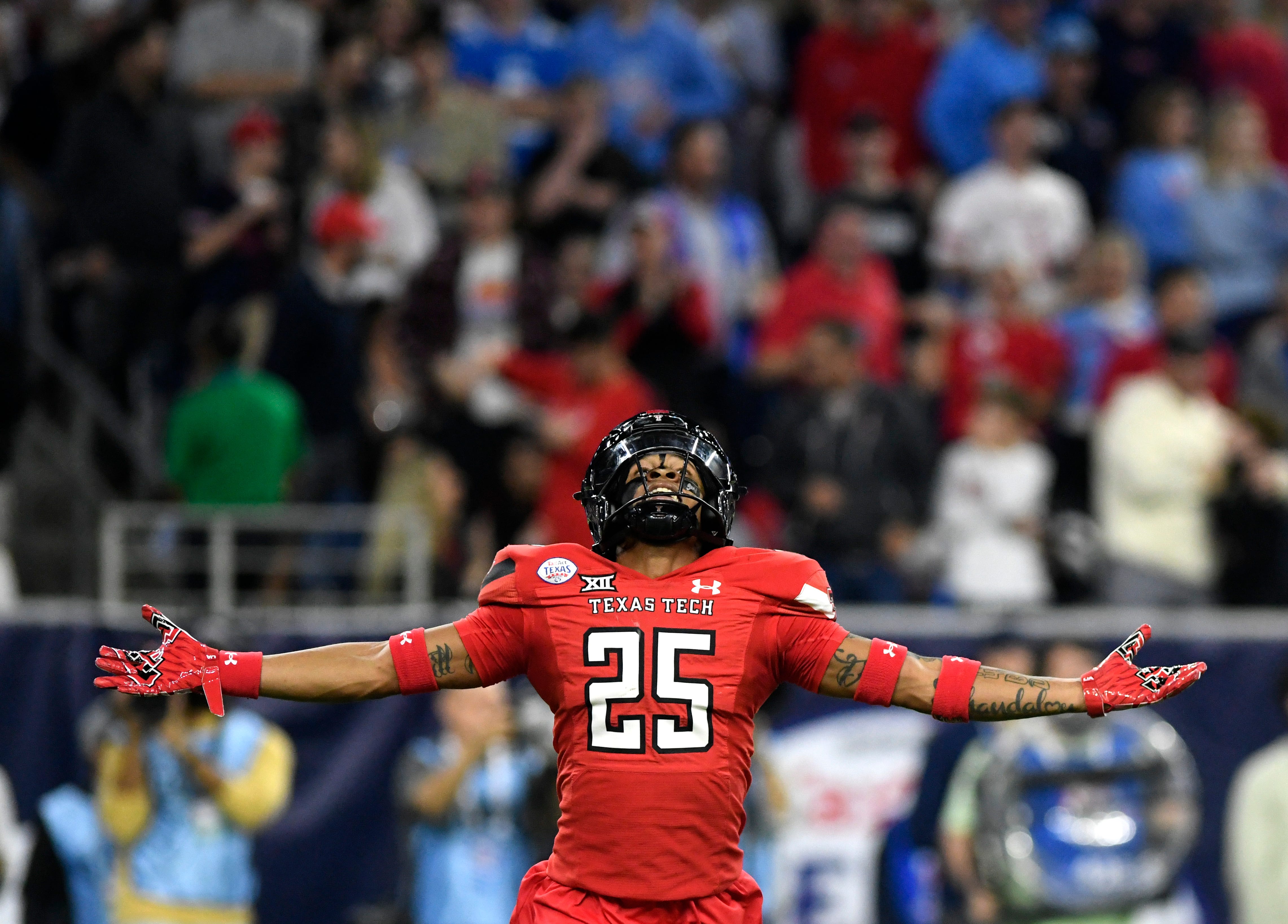 Texas Tech's defensive back Dadrion Taylor-Demerson (25) celebrates his interception against Ole Miss in the Texas Bowl, Wednesday, Dec. 28, 2022, at NRG Stadium in Houston.