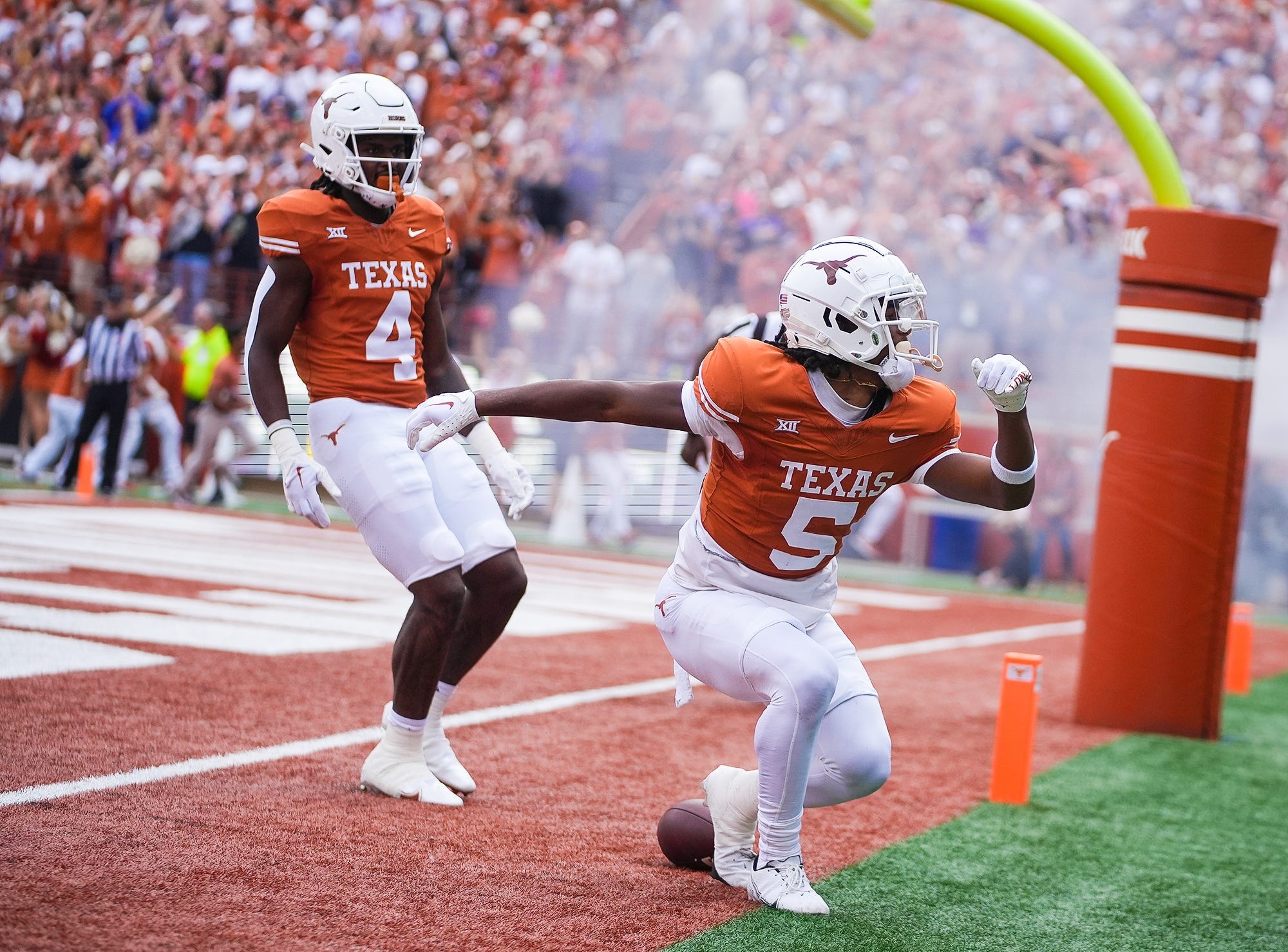 Texas Longhorns wide receiver Adonai Mitchell (5) celebrates a touchdown in the first quarter.