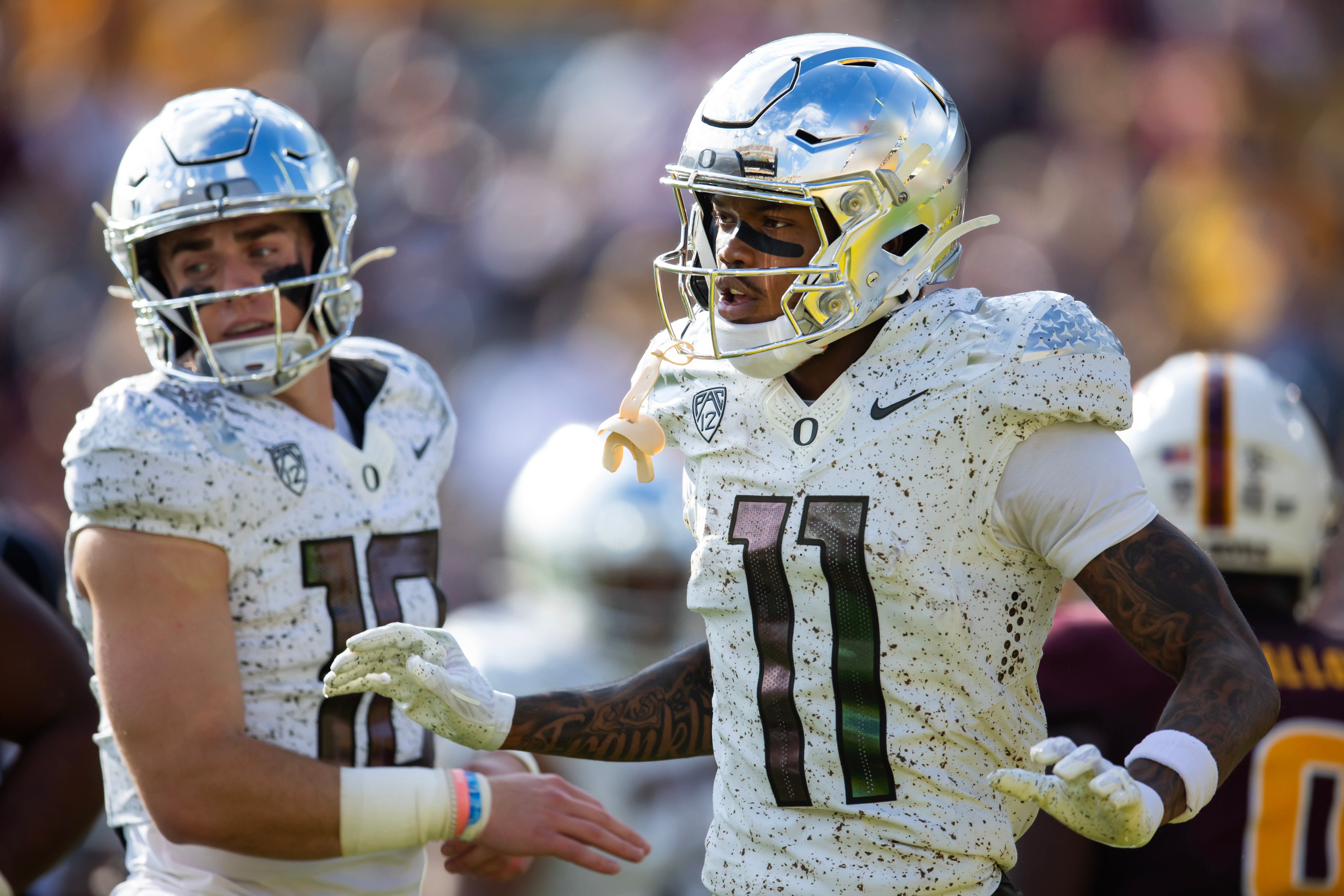 Nov 18, 2023; Tempe, Arizona, USA; Oregon Ducks wide receiver Troy Franklin (11) with quarterback Bo Nix (10) against the Arizona State Sun Devils at Mountain America Stadium.