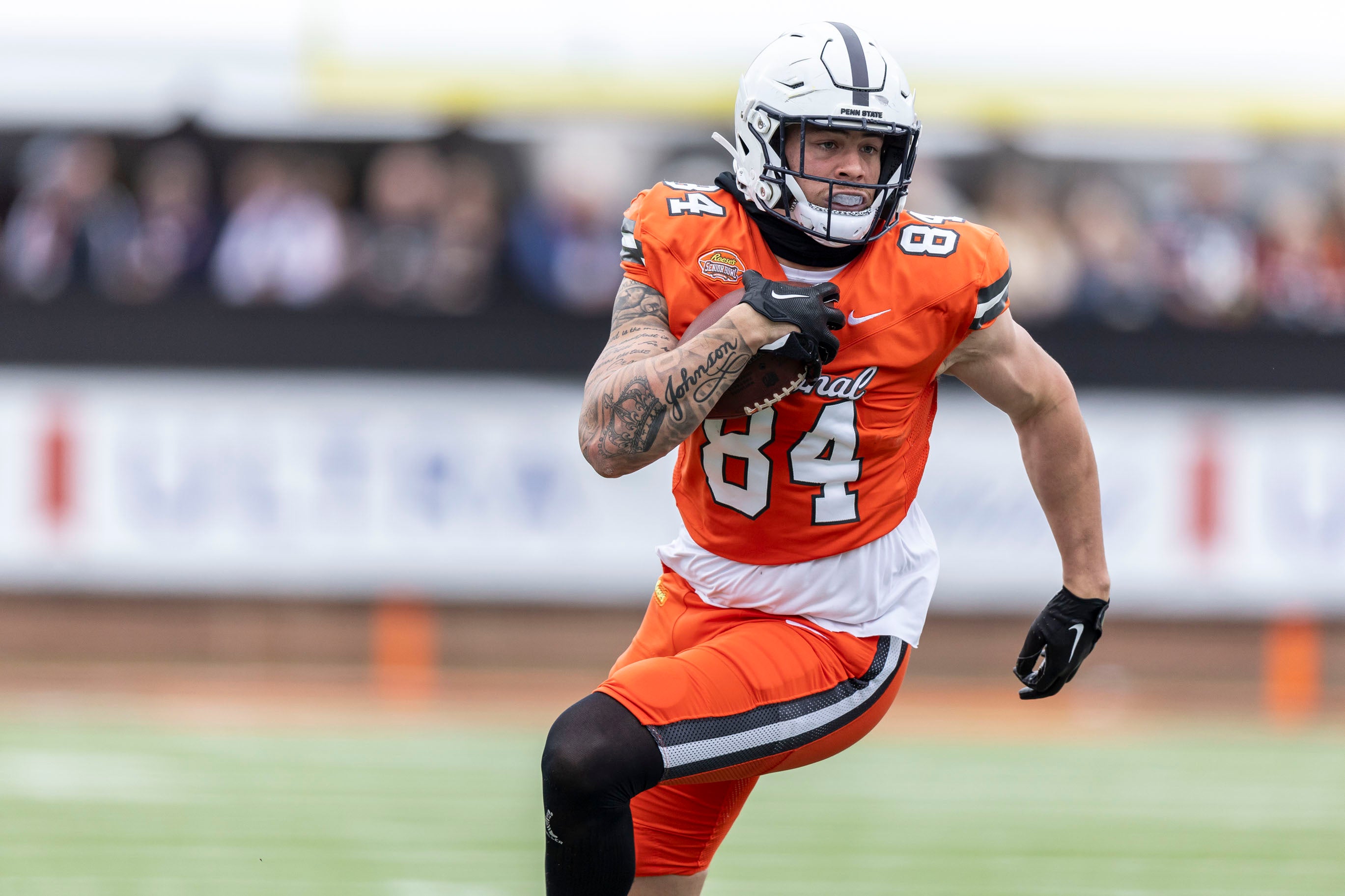 National tight end Theo Johnson of Penn State (84) runs after a catch during the first half of the 2024 Senior Bowl football game at Hancock Whitney Stadium.
