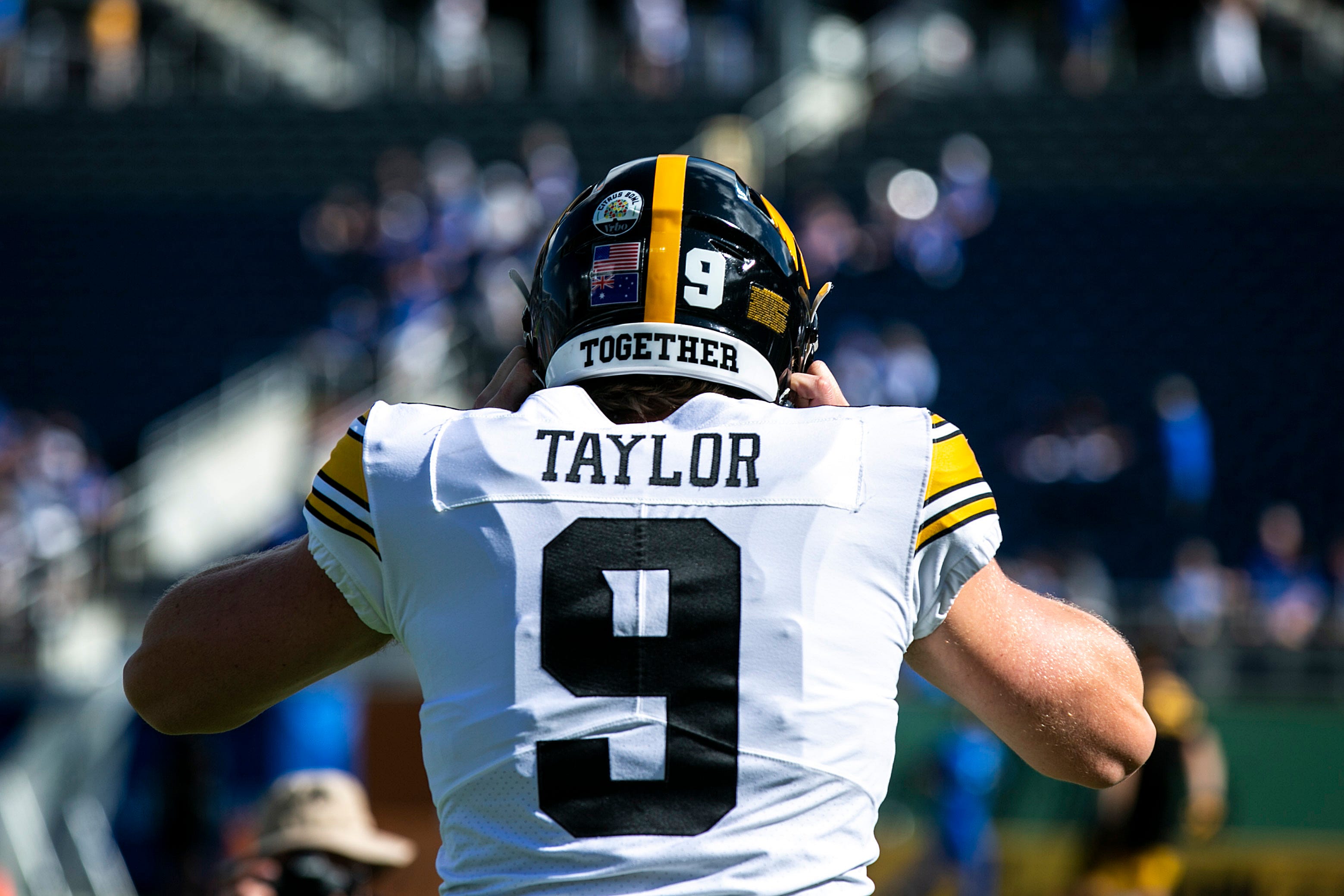 Iowa's Tory Taylor (9) runs onto the field before a NCAA college football game in the Vrbo Citrus Bowl against Kentucky, Saturday, Jan. 1, 2022, at Camping World Stadium in Orlando, Fla. 211231 Iowa Kentucky Citrus Fb Pregame 015 Jpg
