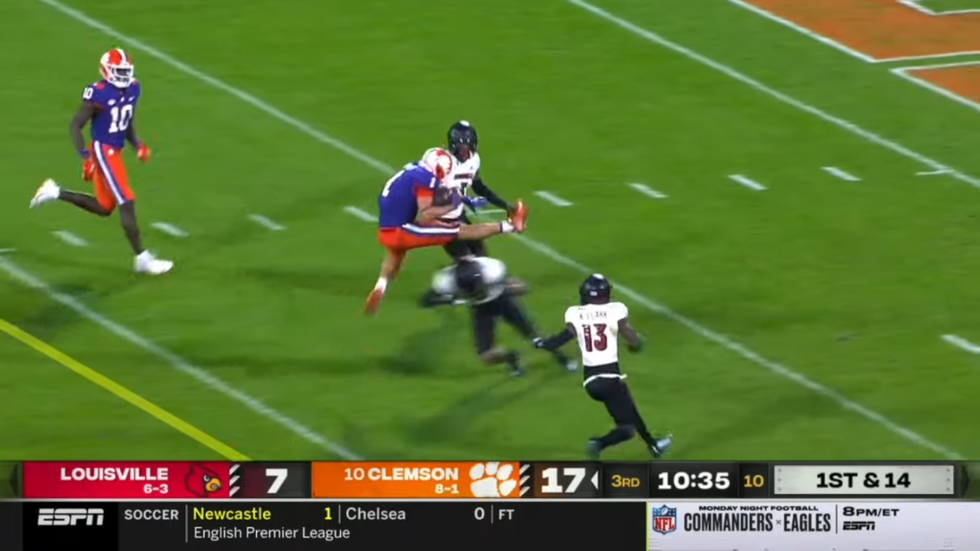 Clemson Tigers running back Will Shipley hurdles a Louisville defender in 2022.