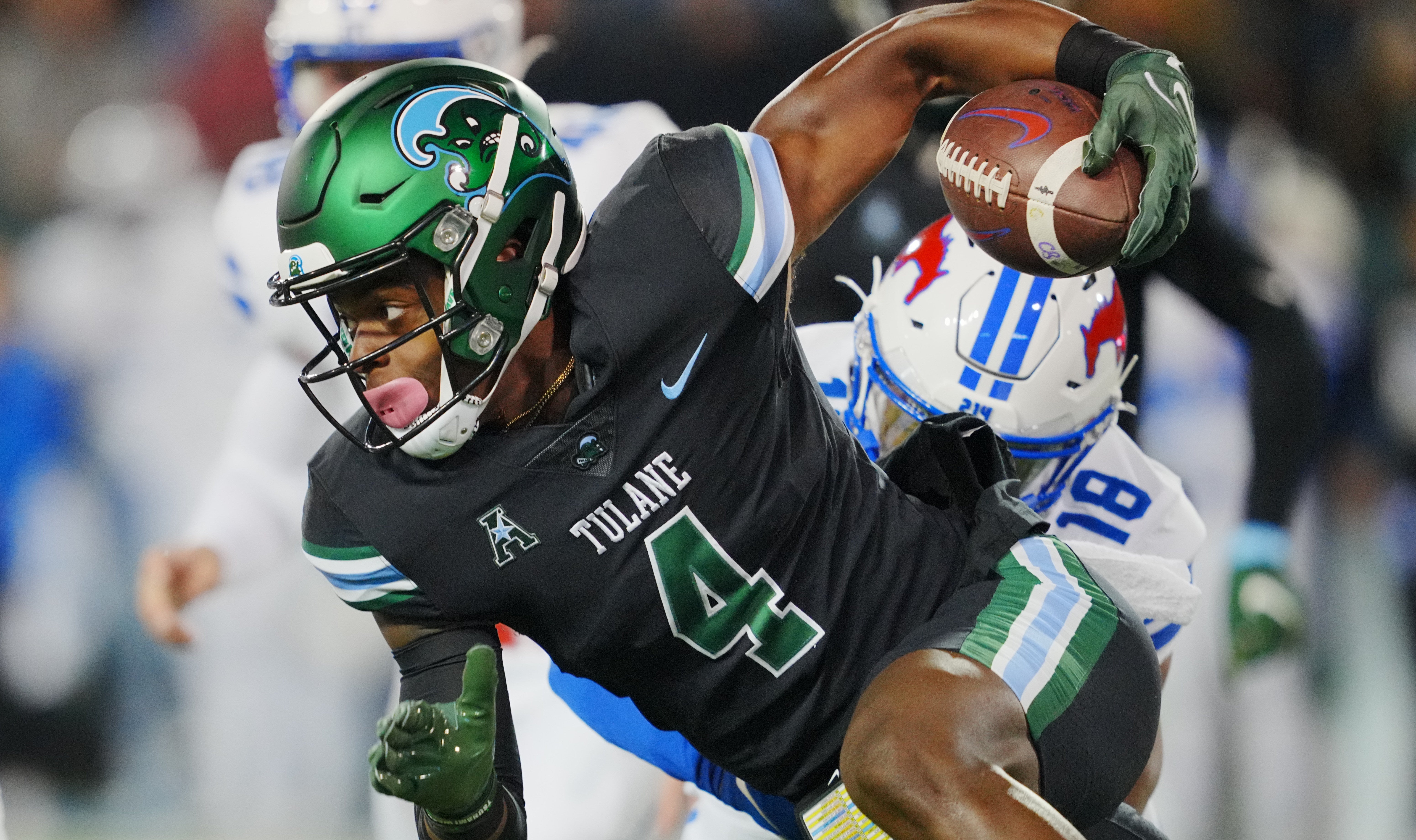 Tulane Green Wave wide receiver Jha'Quan Jackson (4) runs a punt return against the Southern Methodist Mustangs during the first half at Yulman Stadium. Andrew Wevers-USA TODAY Sports