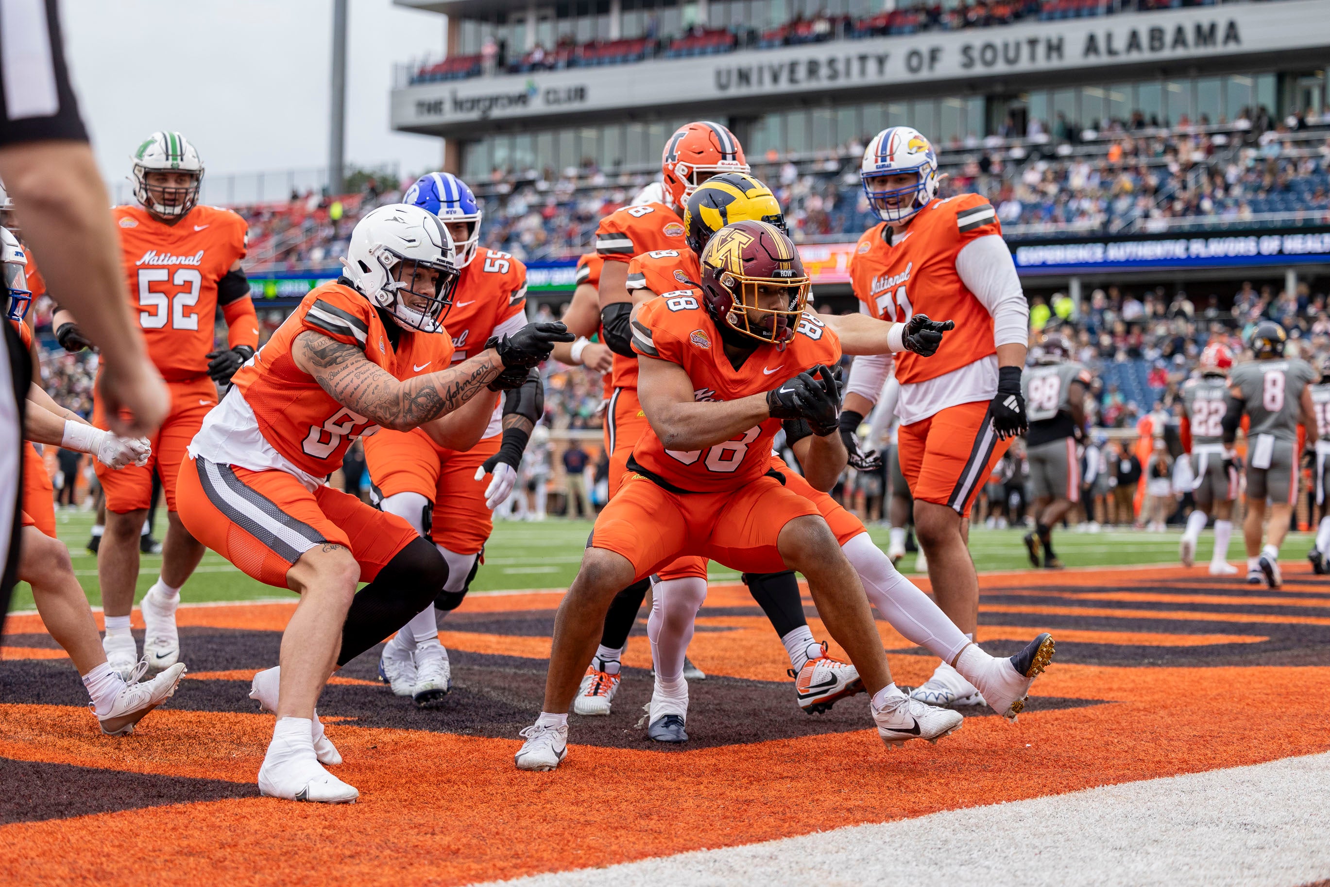 National tight end Brevyn Spann-Ford of Minnesota (88) celebrates with his teammates after his touchdown catch during the first half of the 2024 Senior Bowl football game at Hancock Whitney Stadium.