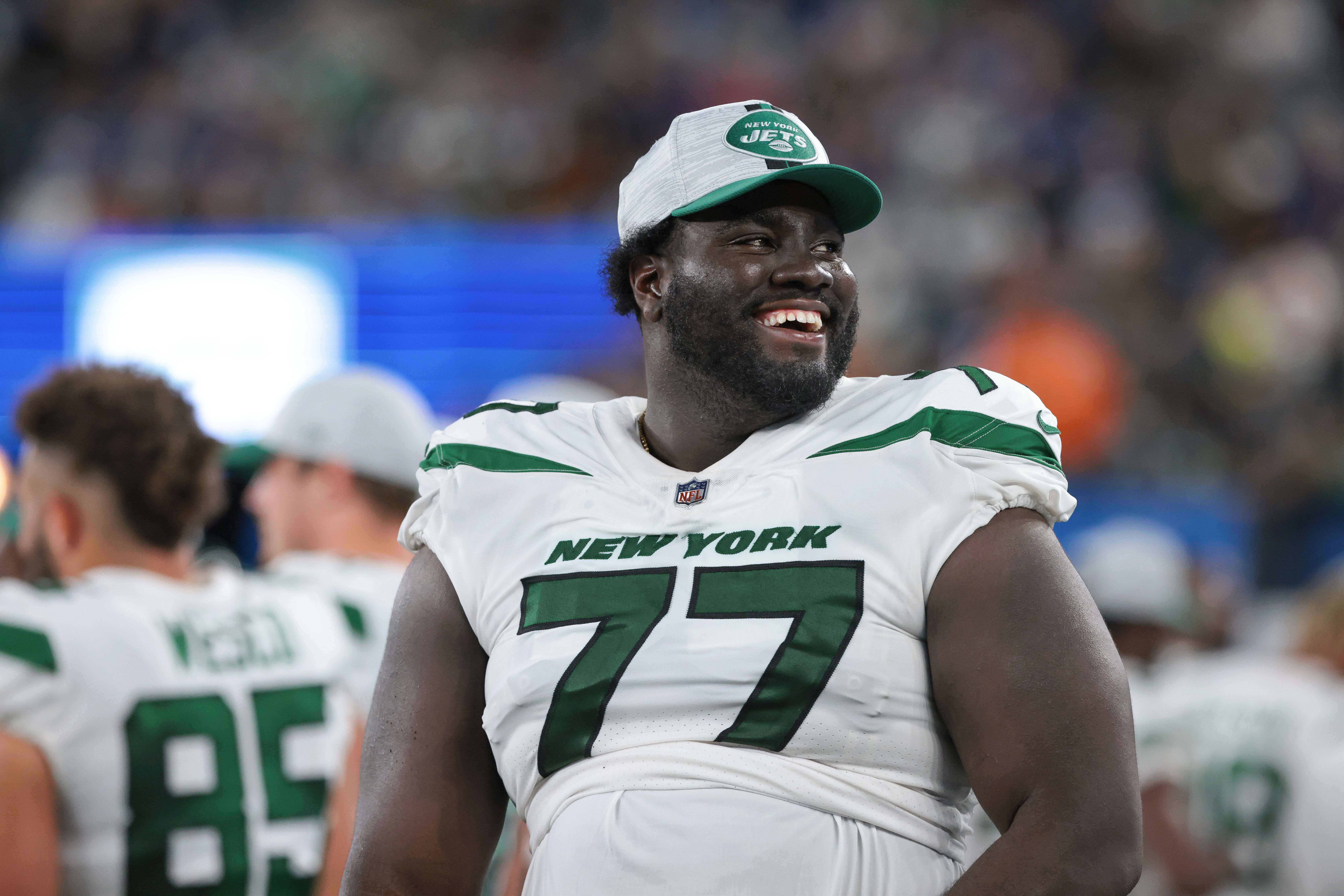New York Jets offensive tackle Mekhi Becton (77) laughs during the second half against the New York Giants at MetLife Stadium.
