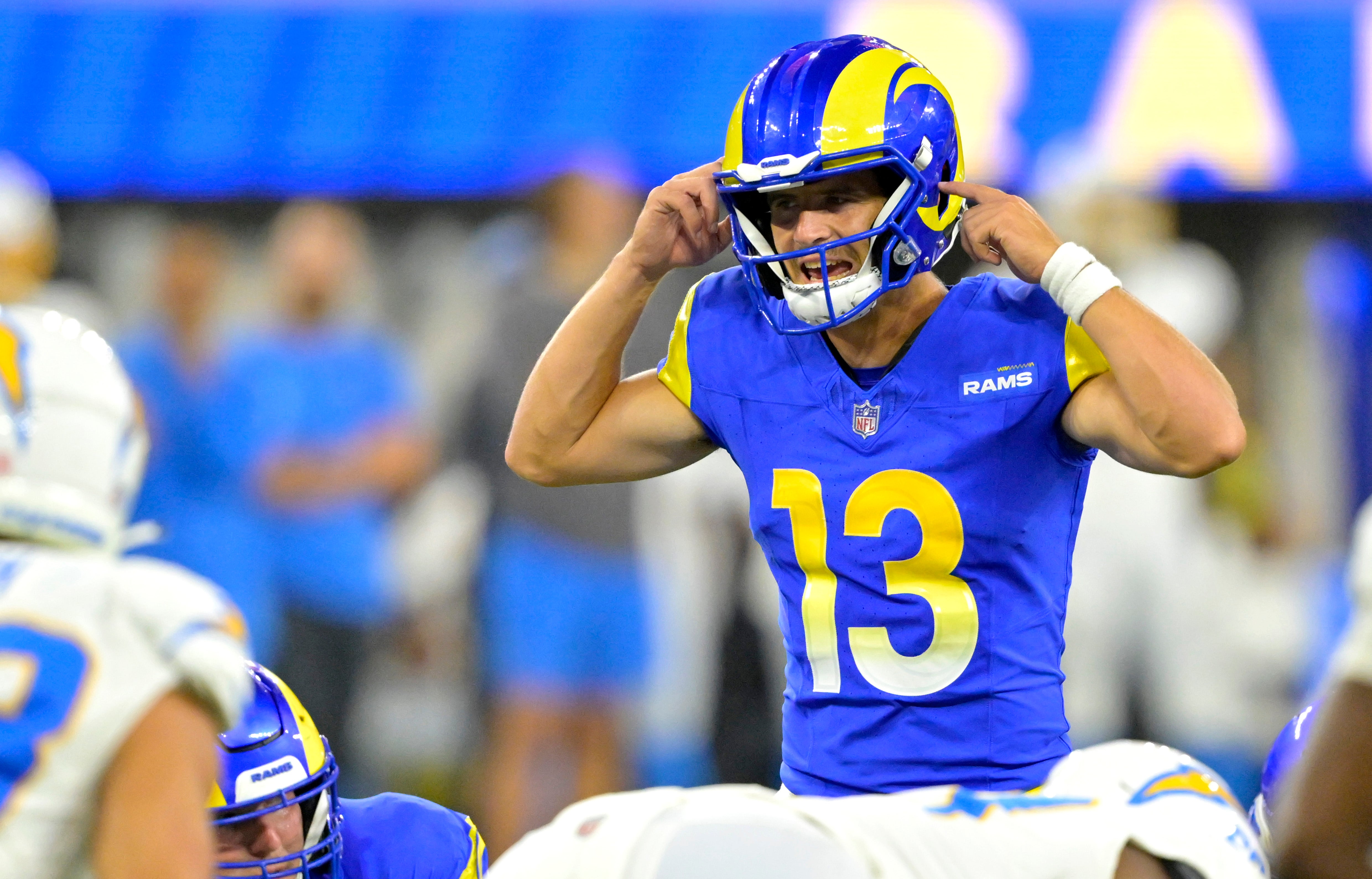 Aug 12, 2023; Inglewood, California, USA; Los Angeles Rams quarterback Stetson Bennett (13) sets to pass in the second half against the Los Angeles Chargers at SoFi Stadium.